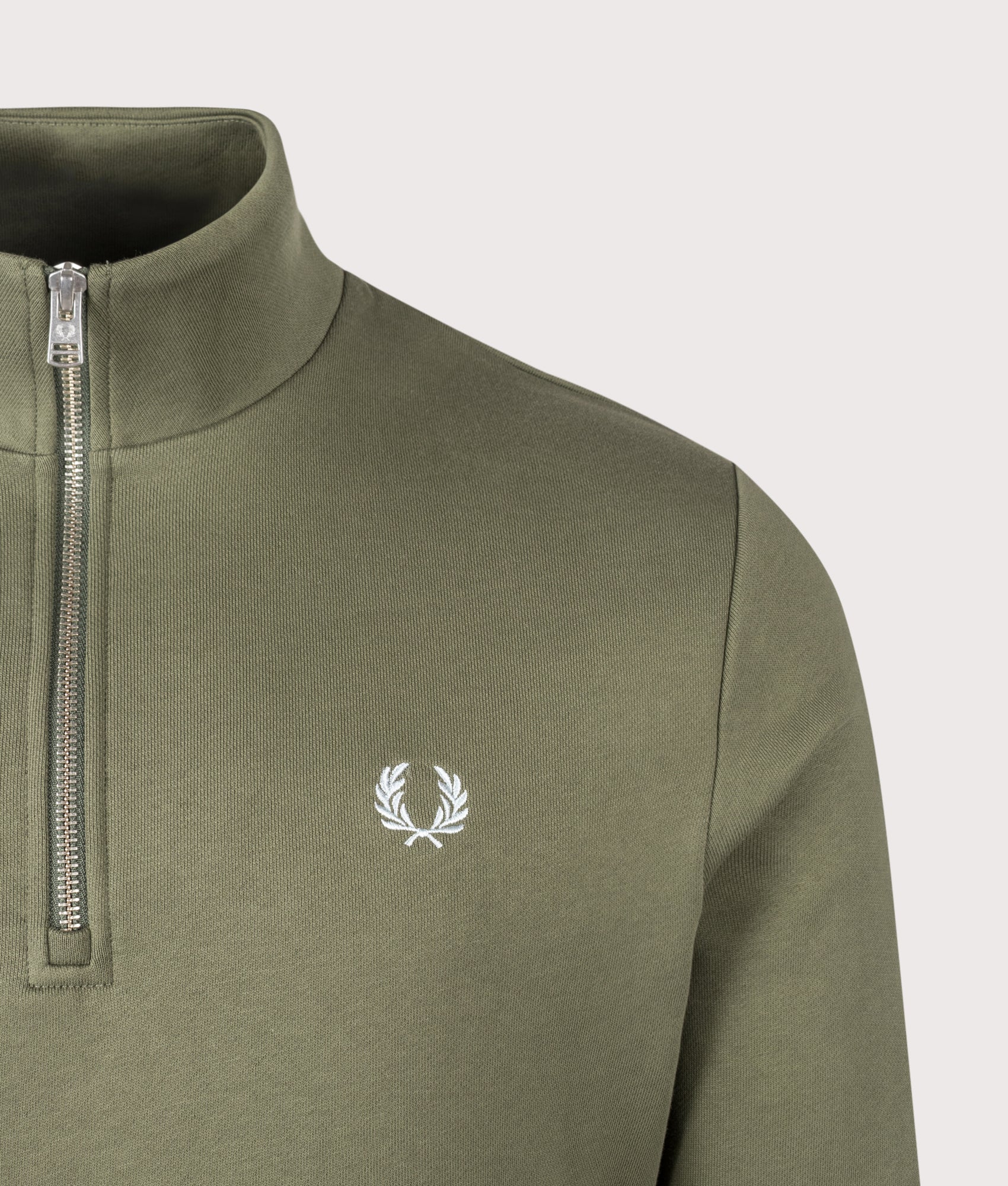 Fred Perry Quarter Zip Sweatshirt in Laurel Wreath Green, Ecru and Dusky Blue at EQVVS Menswear. Detail shot.
