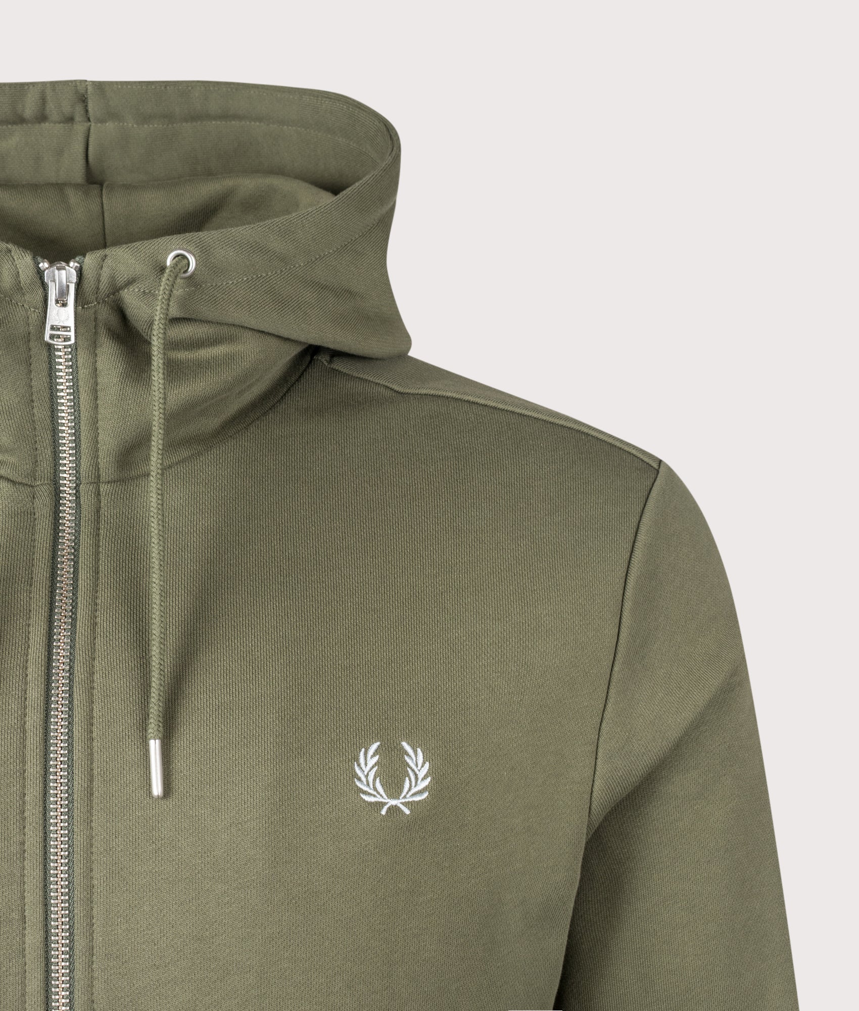 Fred Perry Zip Through Hoodie in Laurel Wreath Green, Ecru and Dusky Blue at EQVVS Menswear. Detail shot.