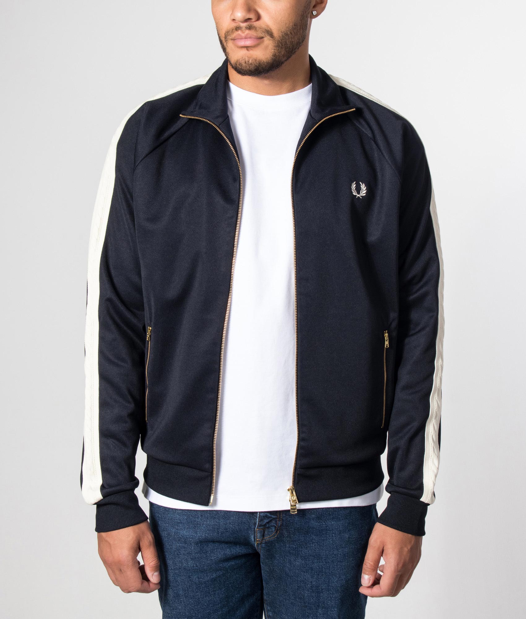 Fred Perry Cable Taped Track Jacket in Navy at EQVVS Menswear. Model front shot.