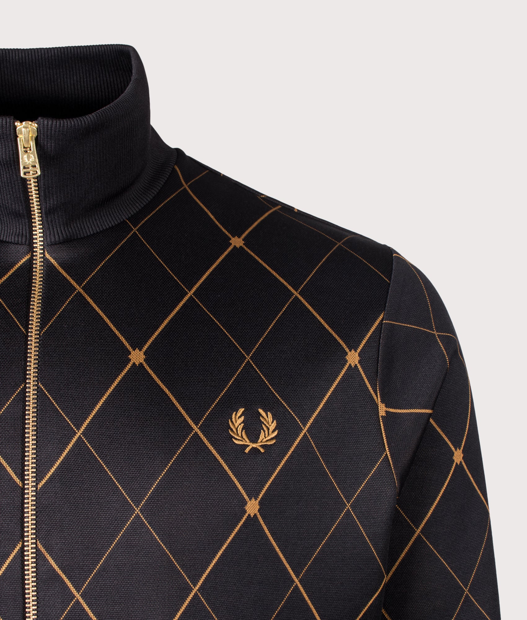 Fred Perry Argyle Track Jacket in Black at EQVVS Menswear. Detail shot.