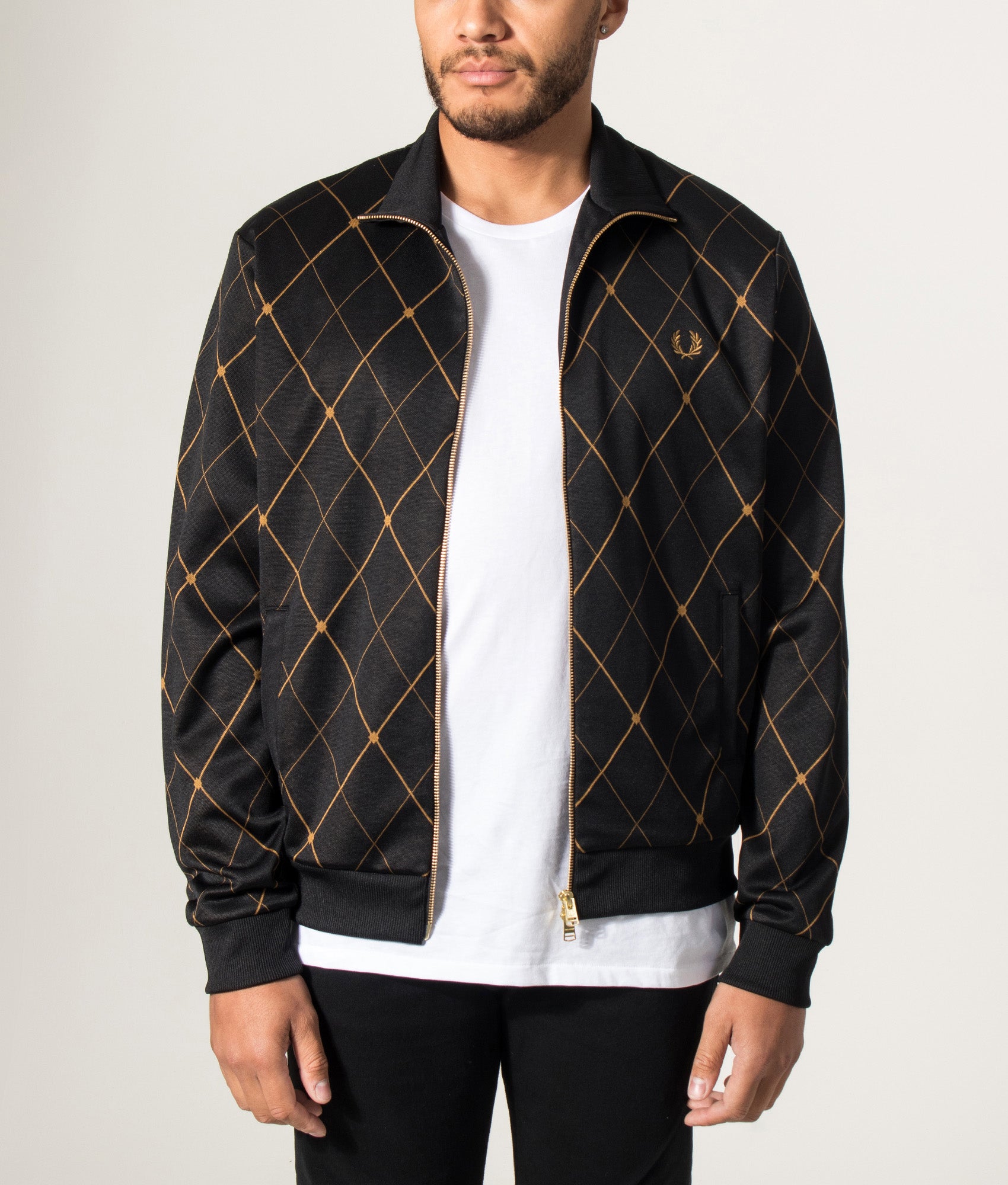 Fred Perry Argyle Track Jacket in Black at EQVVS Menswear. Model front shot.