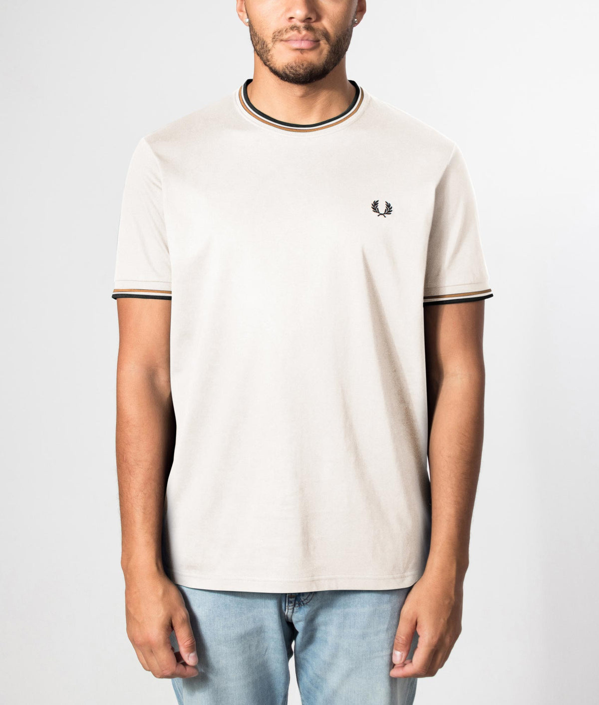 Fred Perry Twin Tipped T-Shirt in Dark Ecru, Dark Caramel and Black at EQVVS Menswear. Front model shot.