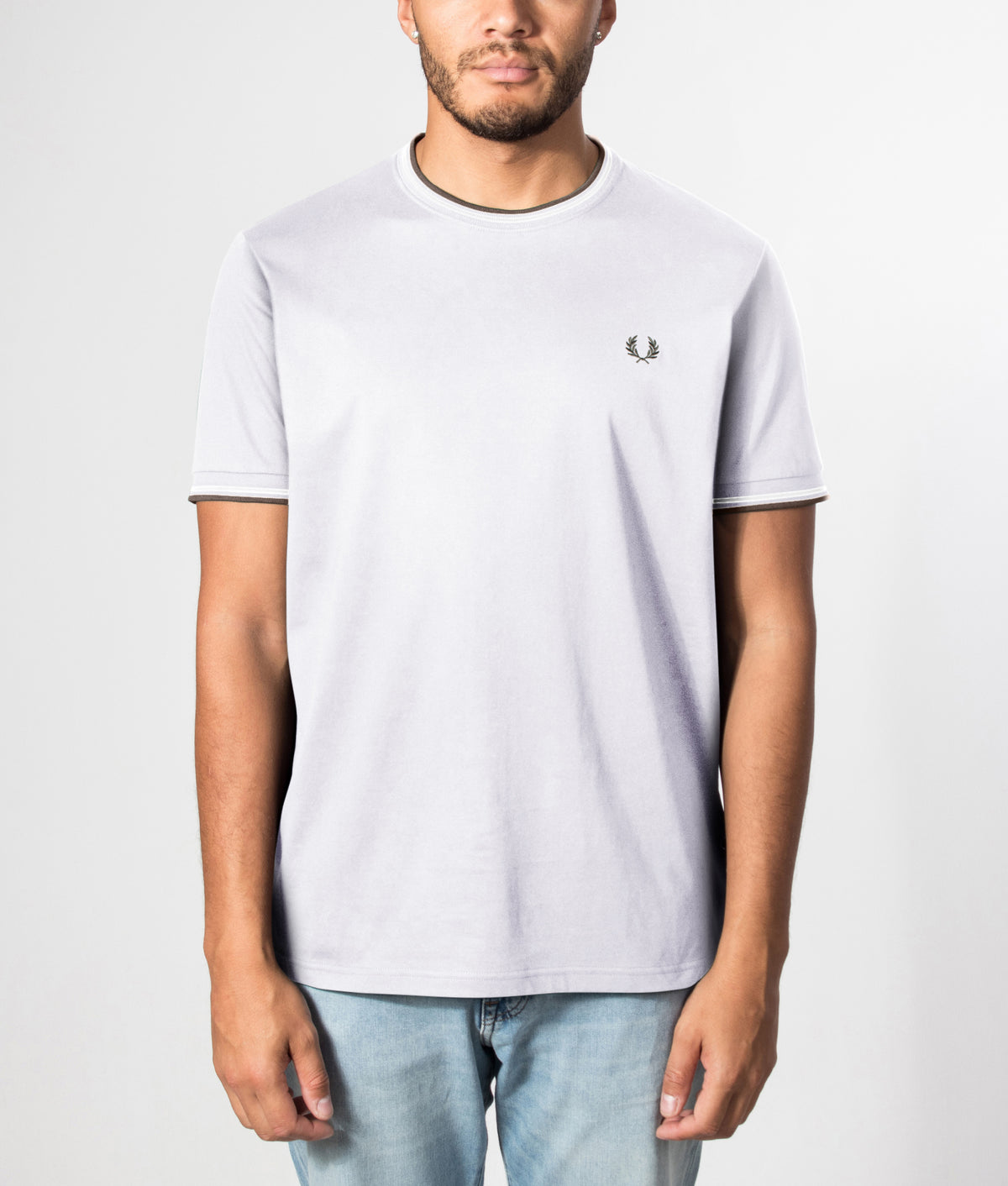 Fred Perry Twin Tipped T-Shirt in Dusky Blue, Ecru and Laurel Wreath Green at EQVVS Menswear. Front model shot.