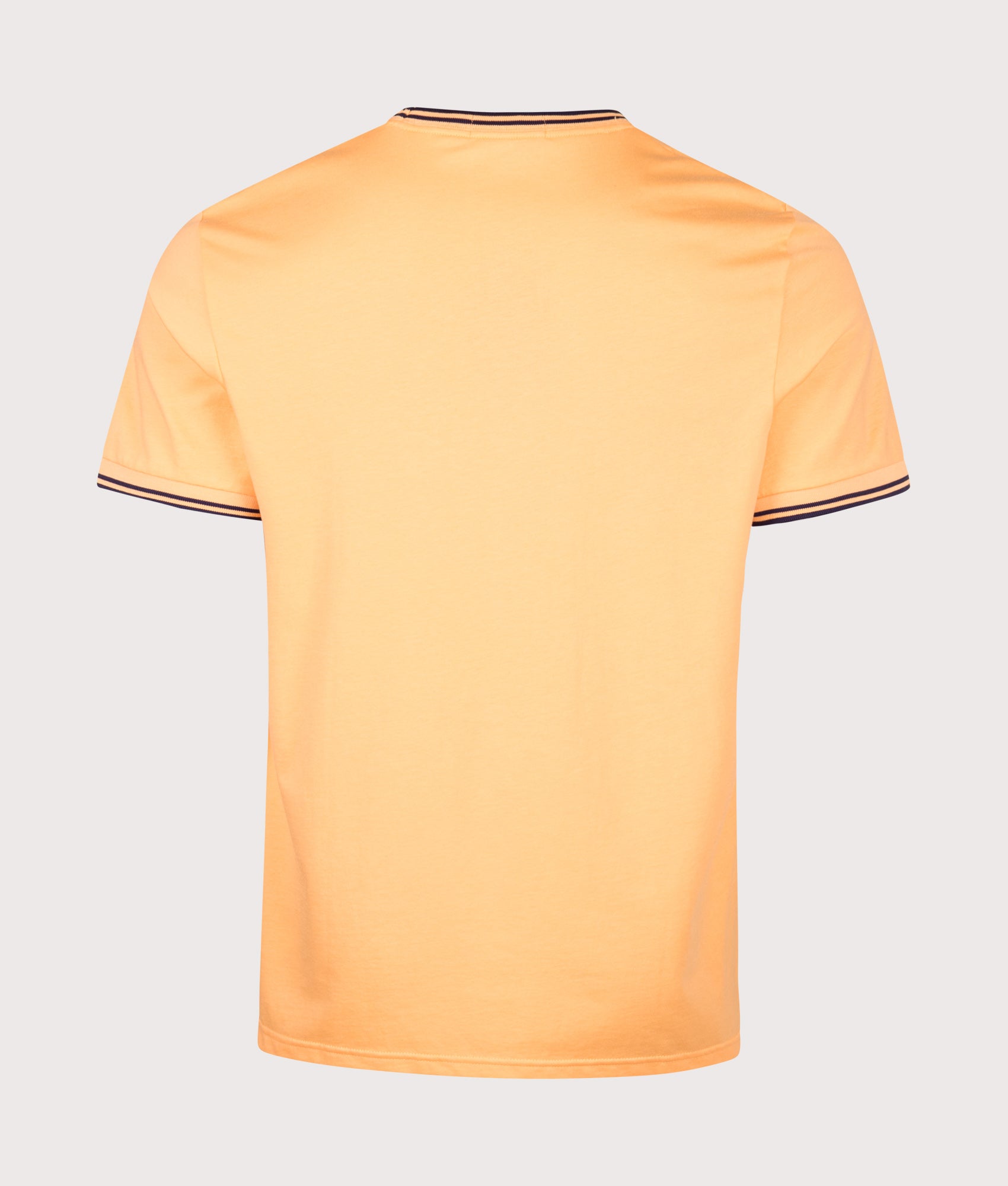 Fred Perry Regular Fit Twin Tipped T-Shirt in Peach and French Navy at EQVVS Menswear. Back shot.