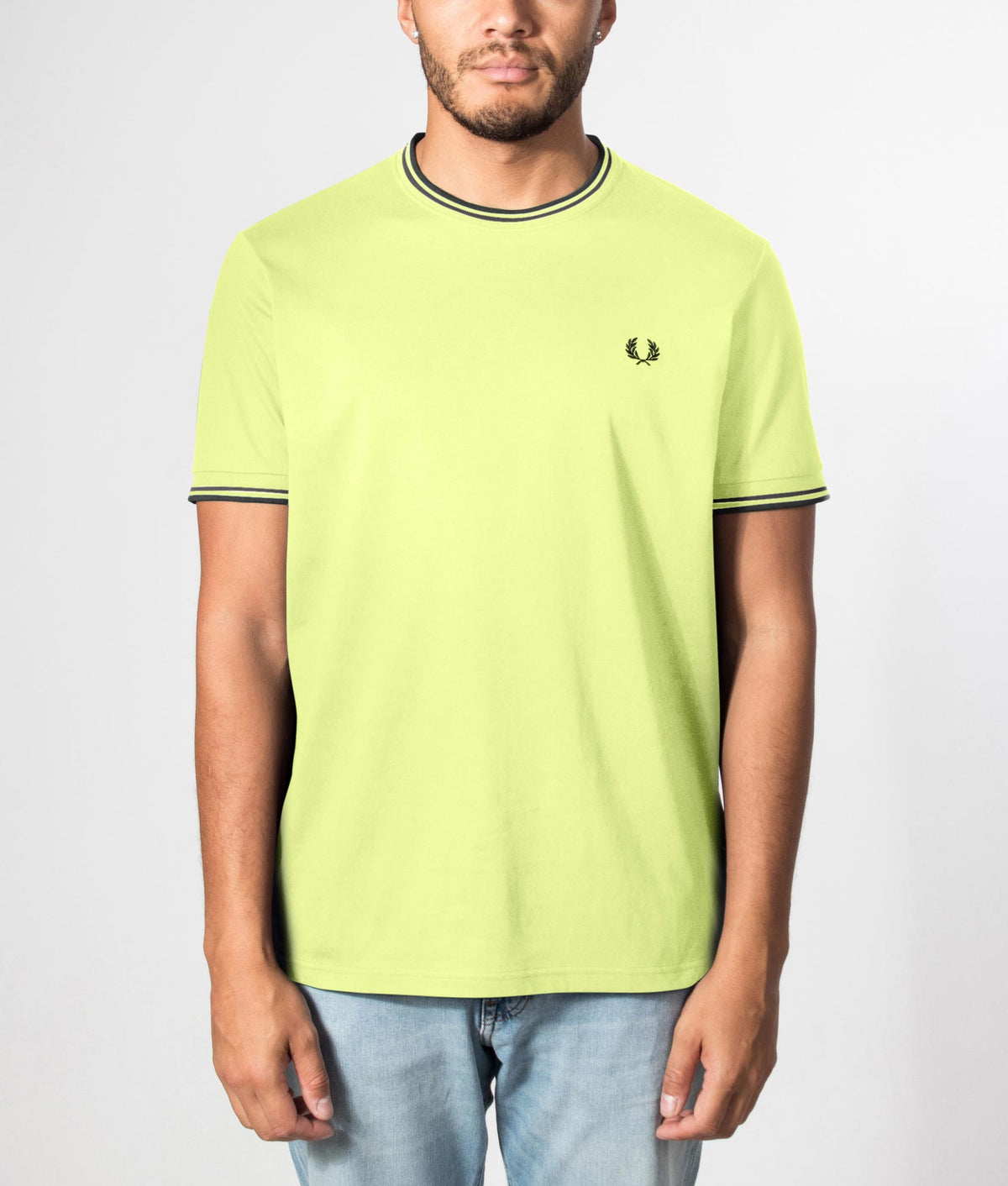 Fred Perry Twin Tipped T-Shirt in Citron and Black at EQVVS Menswear. Front model shot.