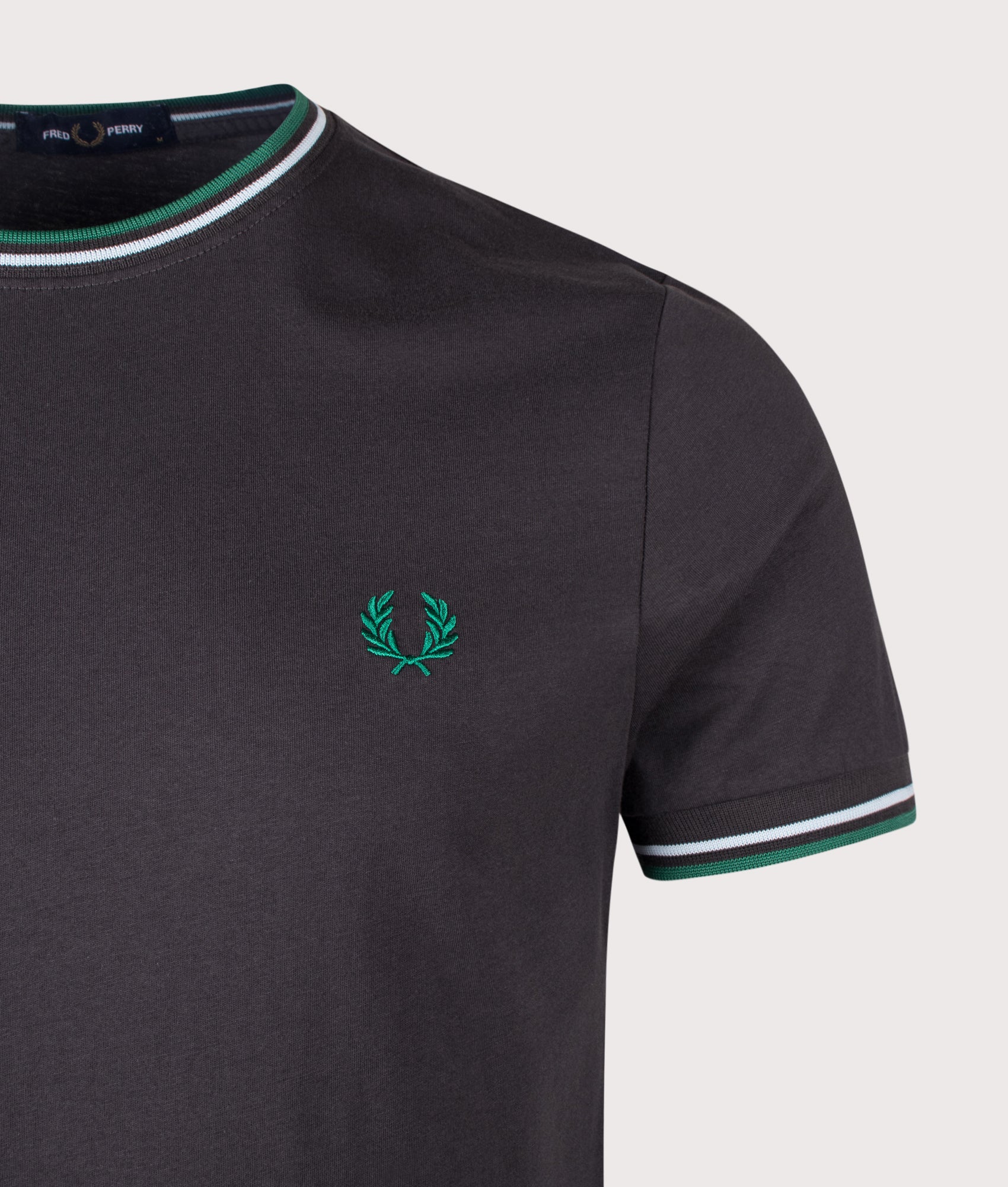 Fred Perry Twin Tipped T-Shirt in Anchor Grey, Light Ice and Sport Green at EQVVS Menswear. Detail shot.
