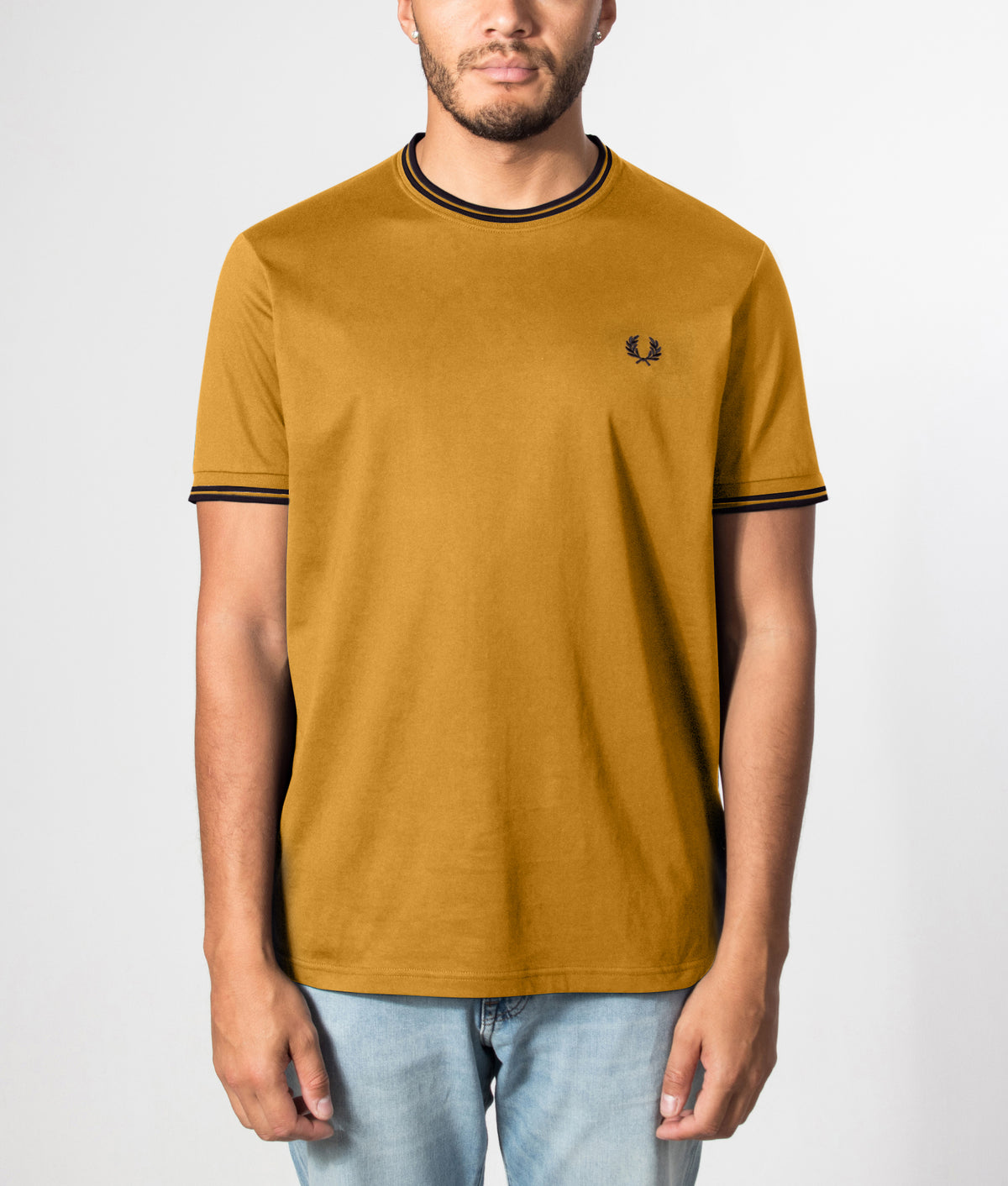 Fred Perry Twin Tipped T-Shirt in Dark Caramel and Navy at EQVVS Menswear. Front model shot.
