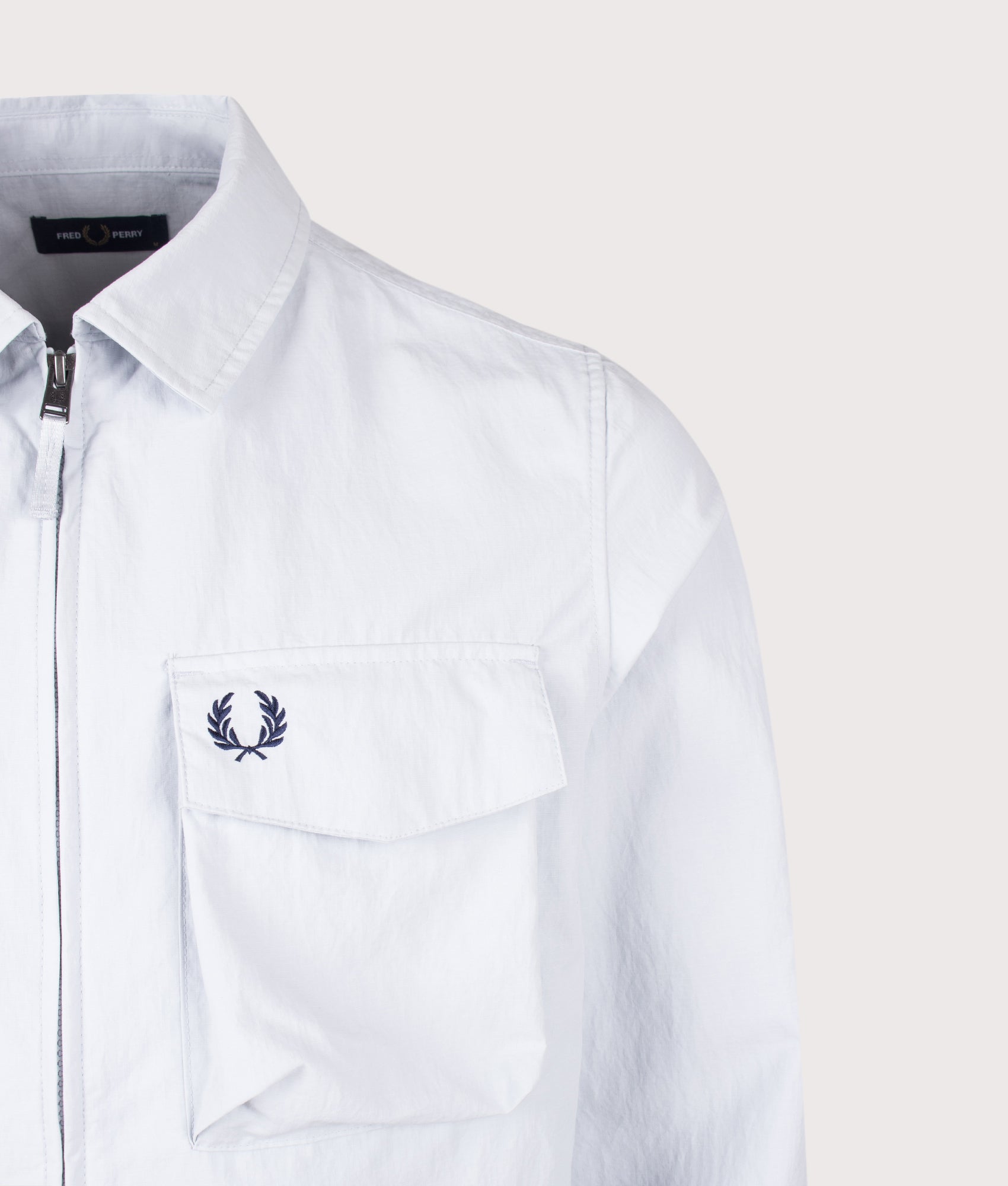Fred Perry Ripstop Pocket Overshirt in Dusky Blue at EQVVS Menswear. Detail shot.