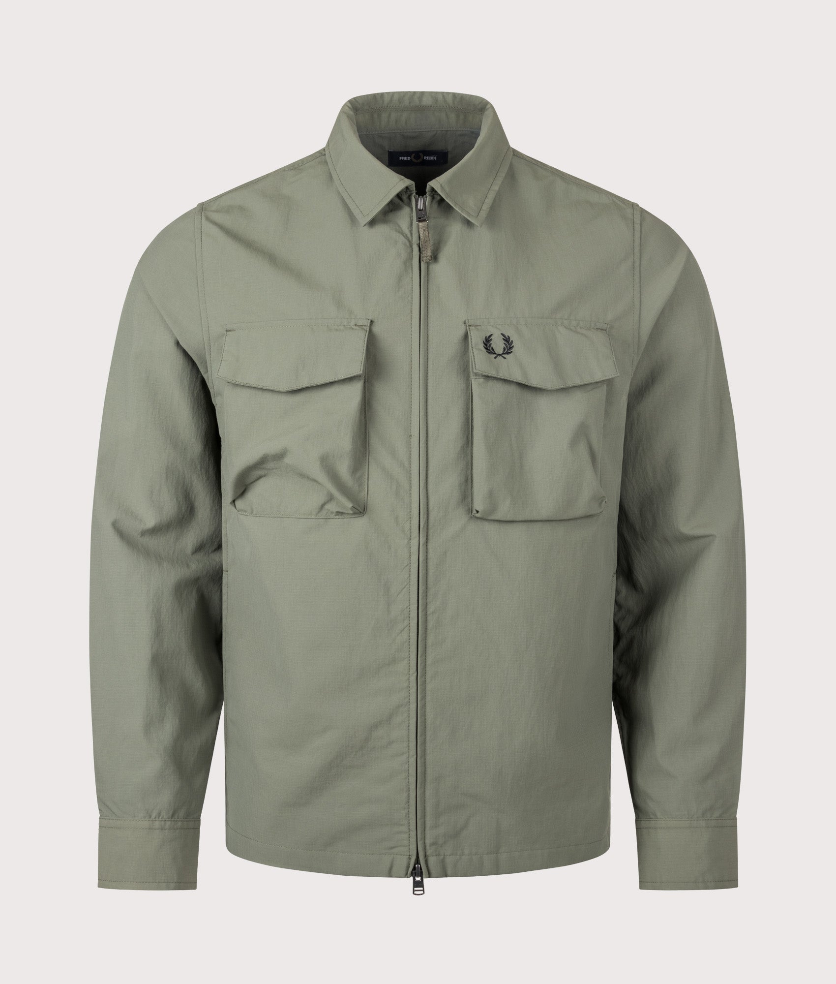 Fred Perry Ripstop Pocket Overshirt in Laurel Wreath Green at EQVVS Menswear. Front shot.