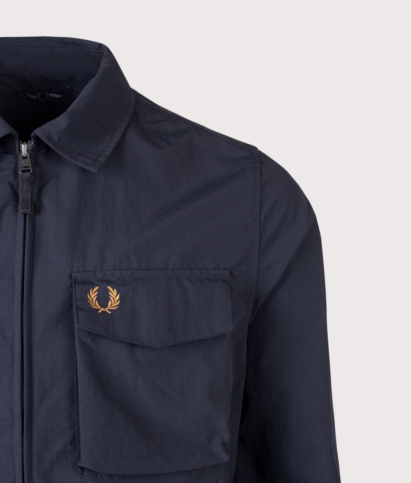 Fred Perry Ripstop Pocket Overshirt in Navy at EQVVS Menswear. Detail shot.