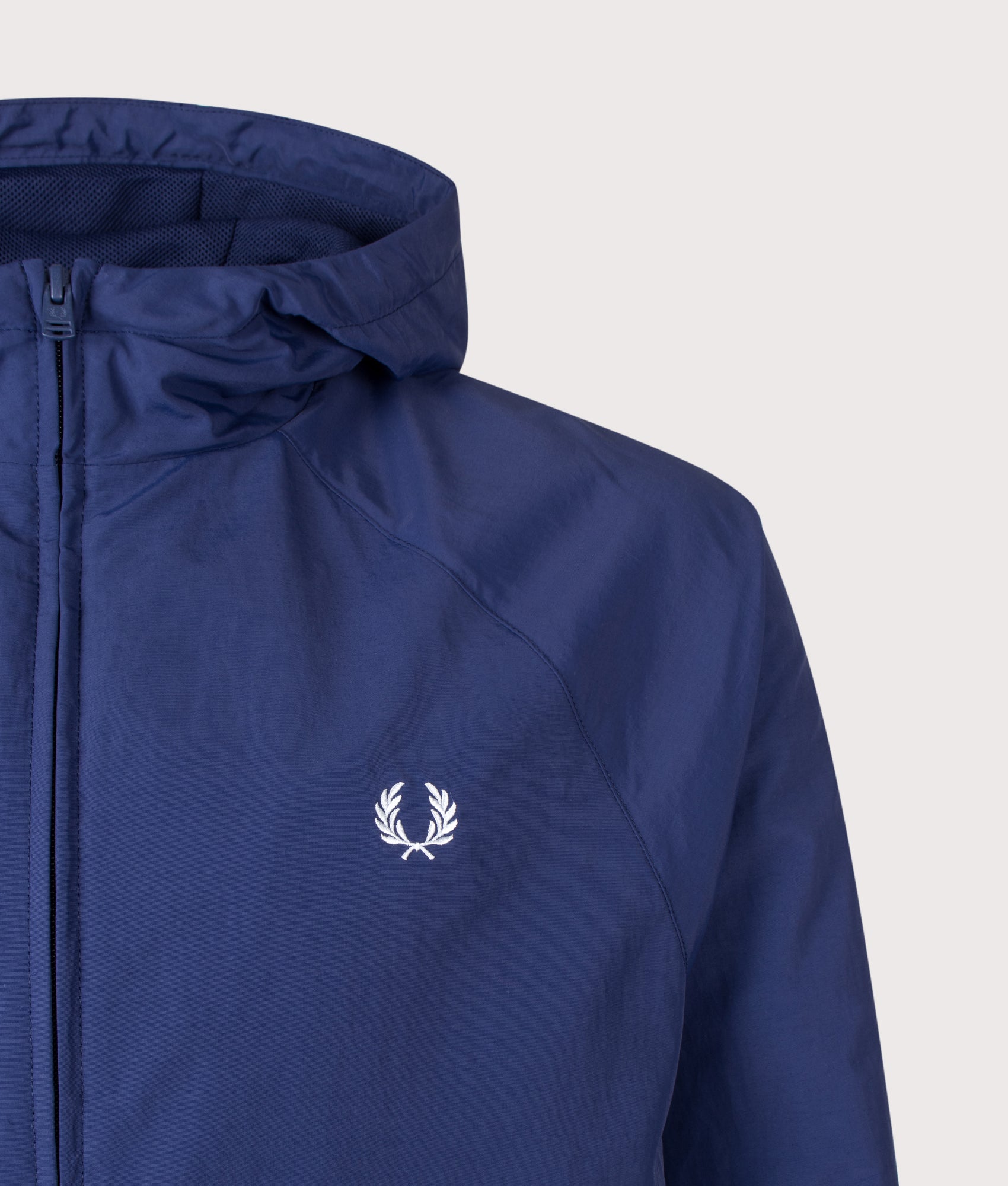Fred Perry Hooded Shell Jacket in French Navy at EQVVS Menswear. Detail shot.