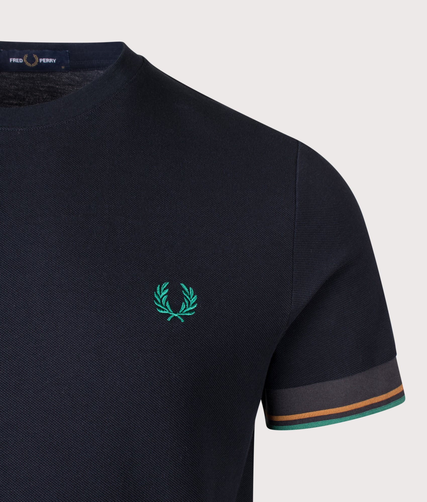Fred Perry Twin Tipped Cuff T-Shirt in Navy at EQVVS Menswear. Detail shot.