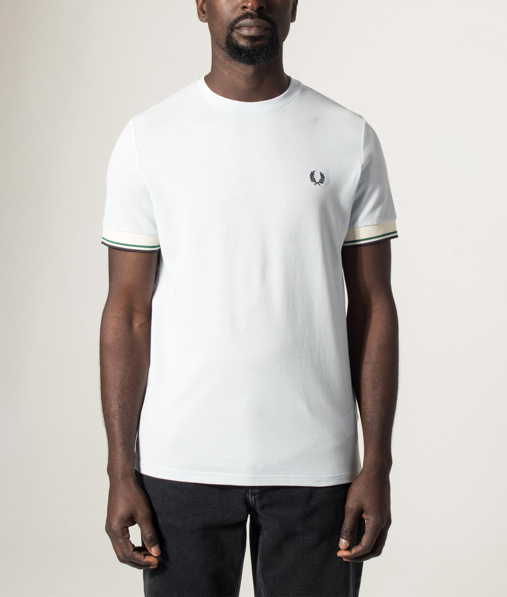 Fred Perry Twin Tipped Cuff T-Shirt in Light Ice at EQVVS Menswear. Model front shot.