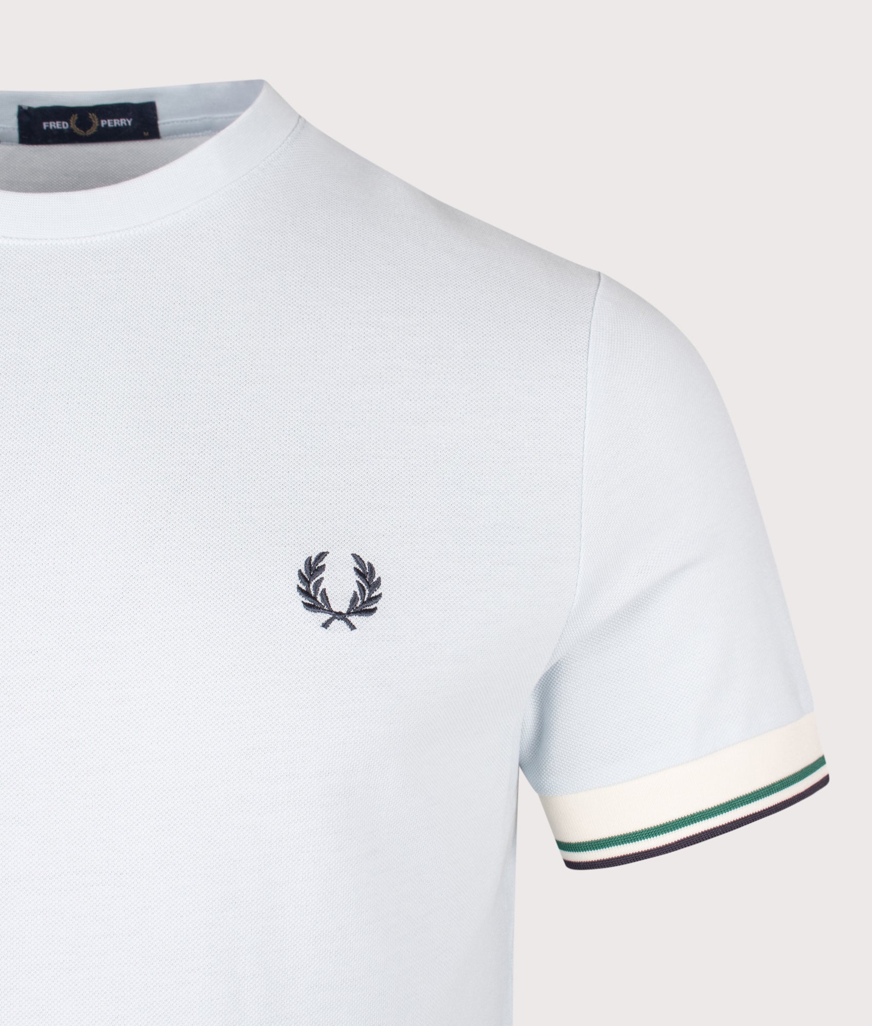 Fred Perry Twin Tipped Cuff T-Shirt in Light Ice at EQVVS Menswear. Detail shot.