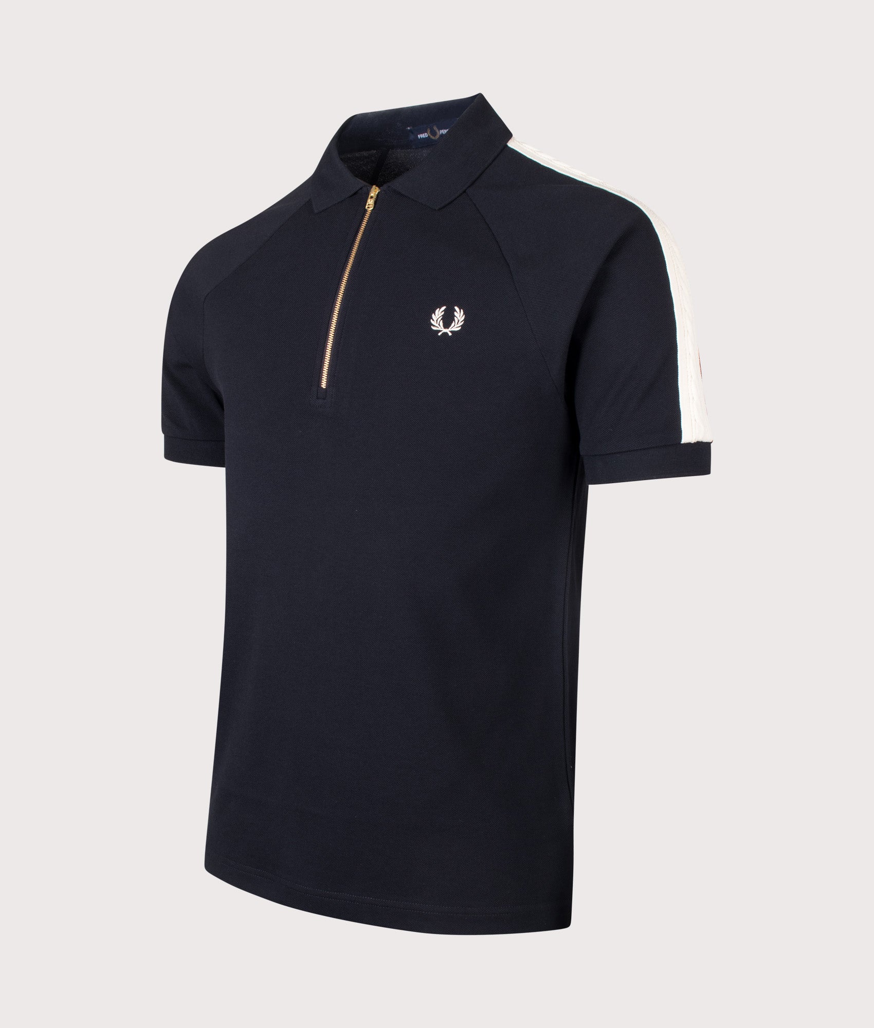 Fred Perry Cable Taped Polo Shirt in Navy at EQVVS Menswear. Angled front shot.