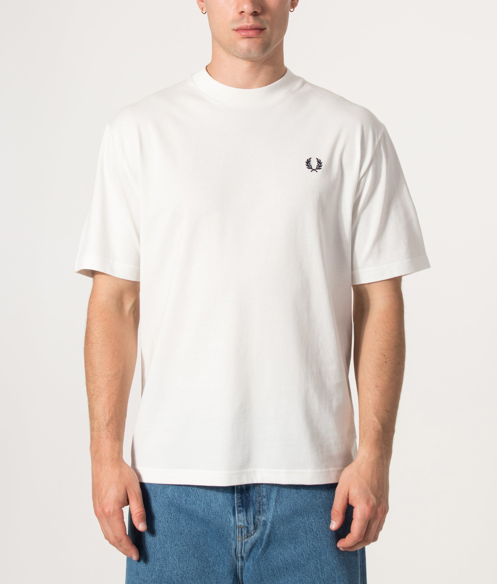 Fred Perry Relaxed Fit Back Print Fred Perry Text T-Shirt in Snow White at EQVVS Menswear. Model front shot.