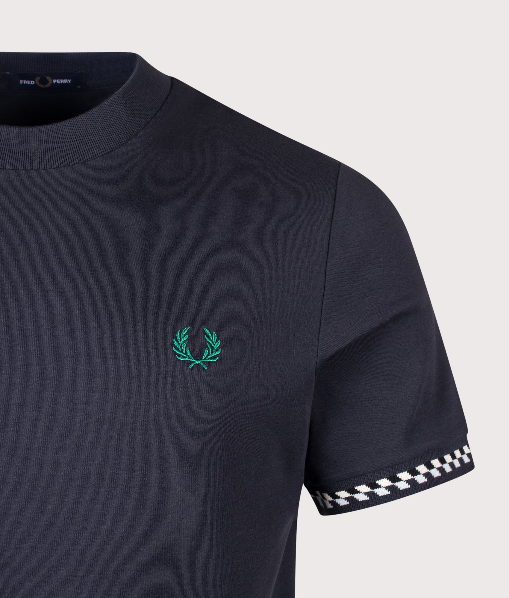 Fred Perry Jacquard Cuff T-Shirt in Navy at EQVVS Menswear. Detail shot.