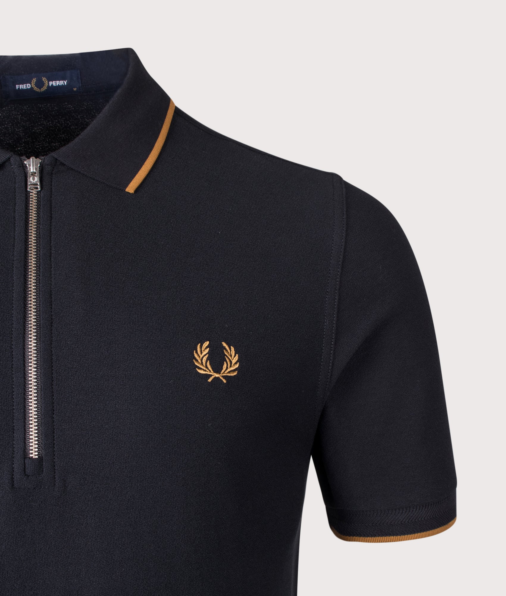 Fred Perry Crepe Piqué Polo Shirt in Black at EQVVS Menswear. Detail shot.