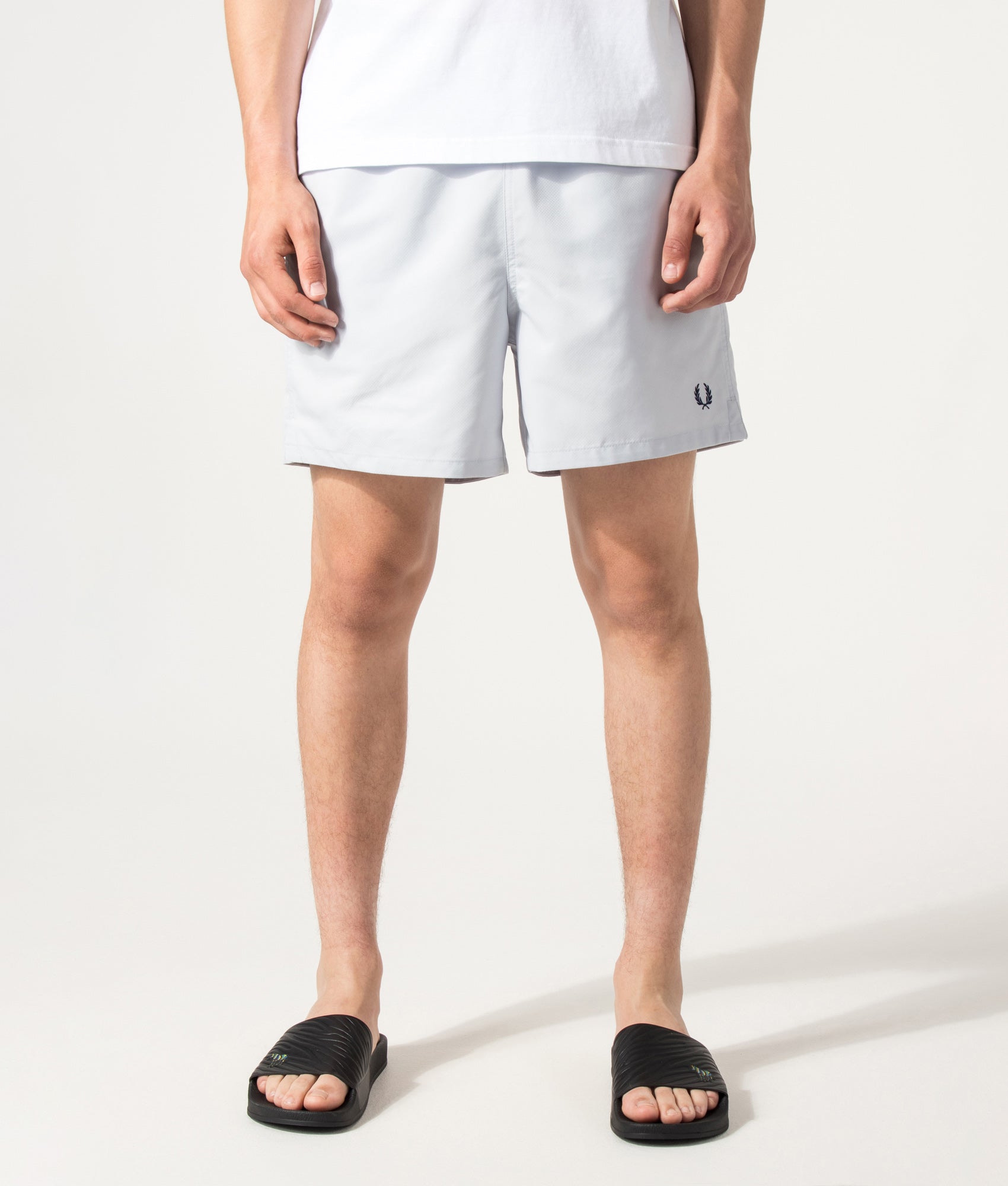 Fred Perry Swimshorts in Dusky blue at EQVVS Menswear. Model front shot.