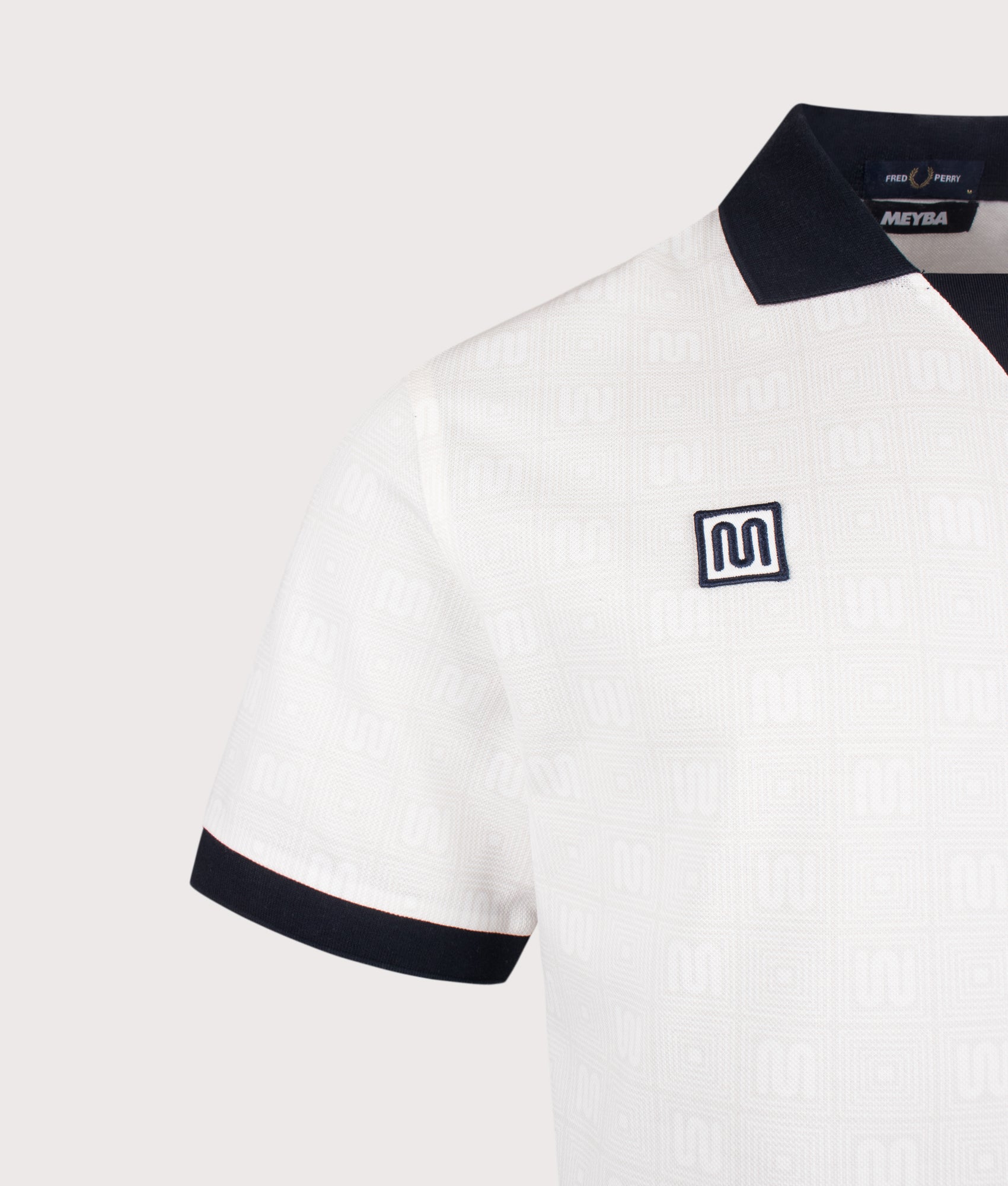 Meyba Printed Polo Shirt in Ecru by Fred Perry. Shot by EQVVS. Detail shot.