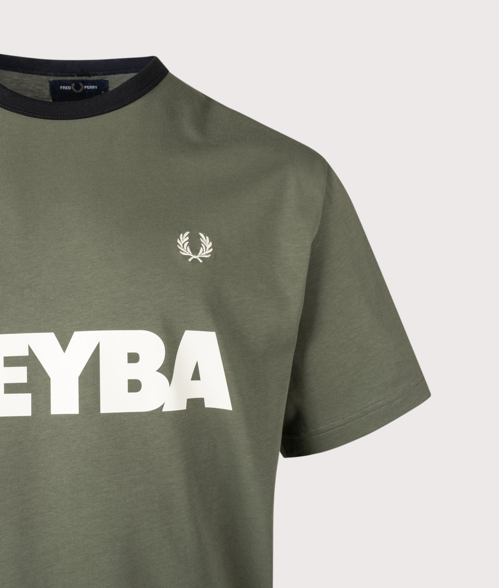 Meyba Ringer T-Shirt in Laurel Wreath Green by Fred Perry. Shot by EQVVS. Second detail shot.