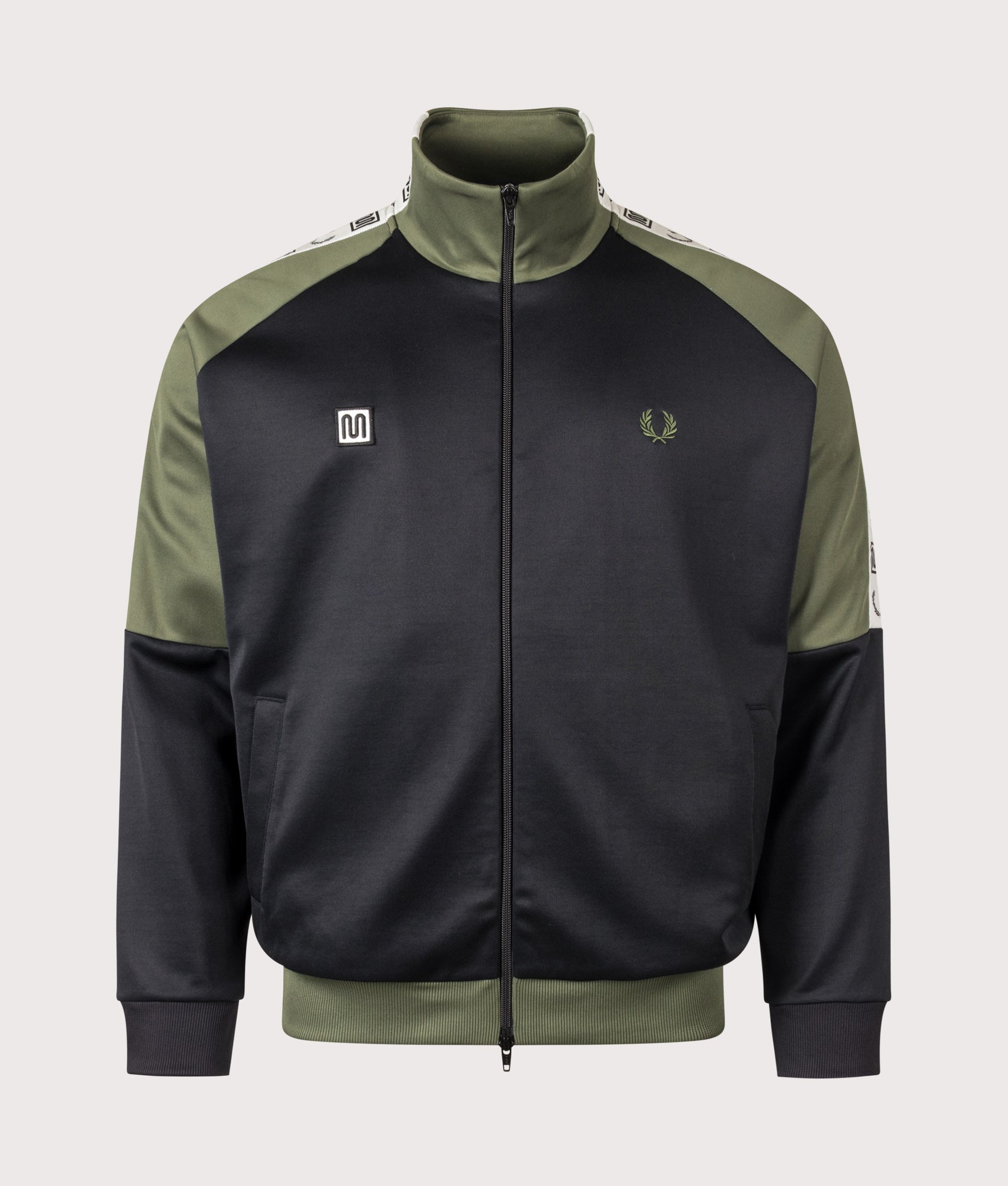 Meyba Taped Raglan Track Jacket in Black by Fred Perry. Shot by EQVVS. Front shot.
