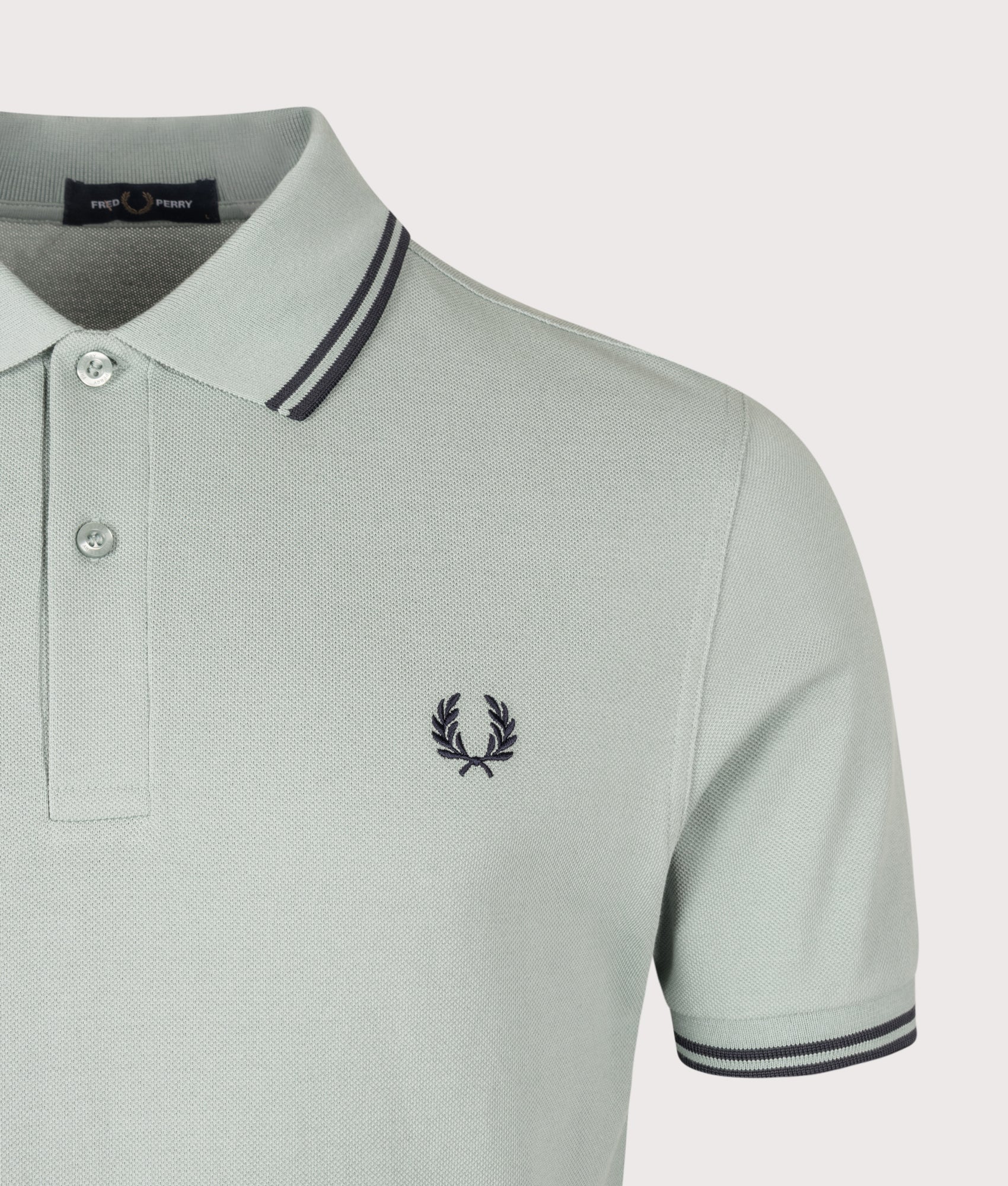 Fred Perry Twin Tipped Polo Shirt in Silver Blue and Dark Airforce at EQVVS Menswear. Detail shot.
