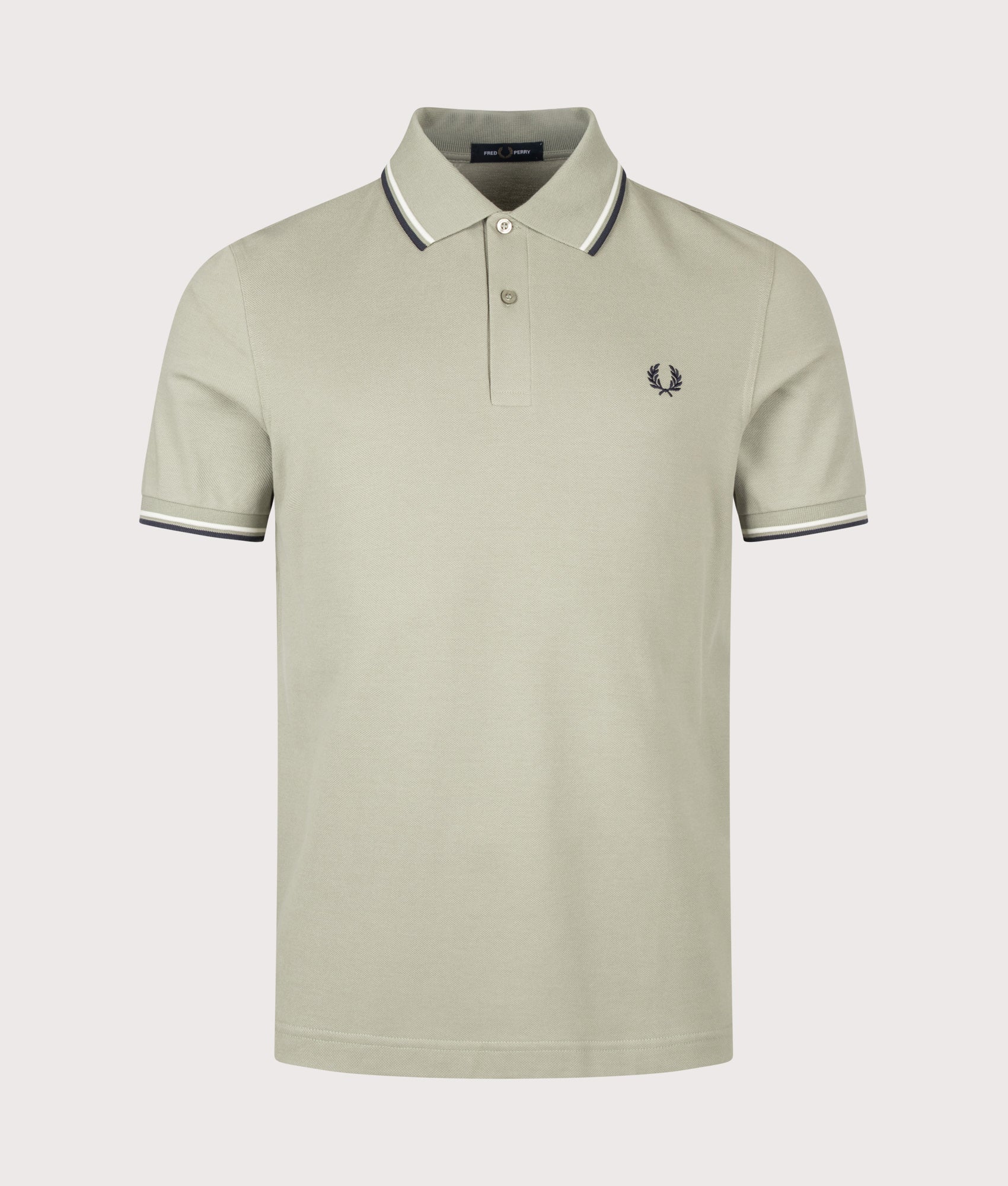 Fred Perry Twin Tipped Polo Shirt in Seagrass, Ecru and Dark Airforce at EQVVS Menswear. Front shot.