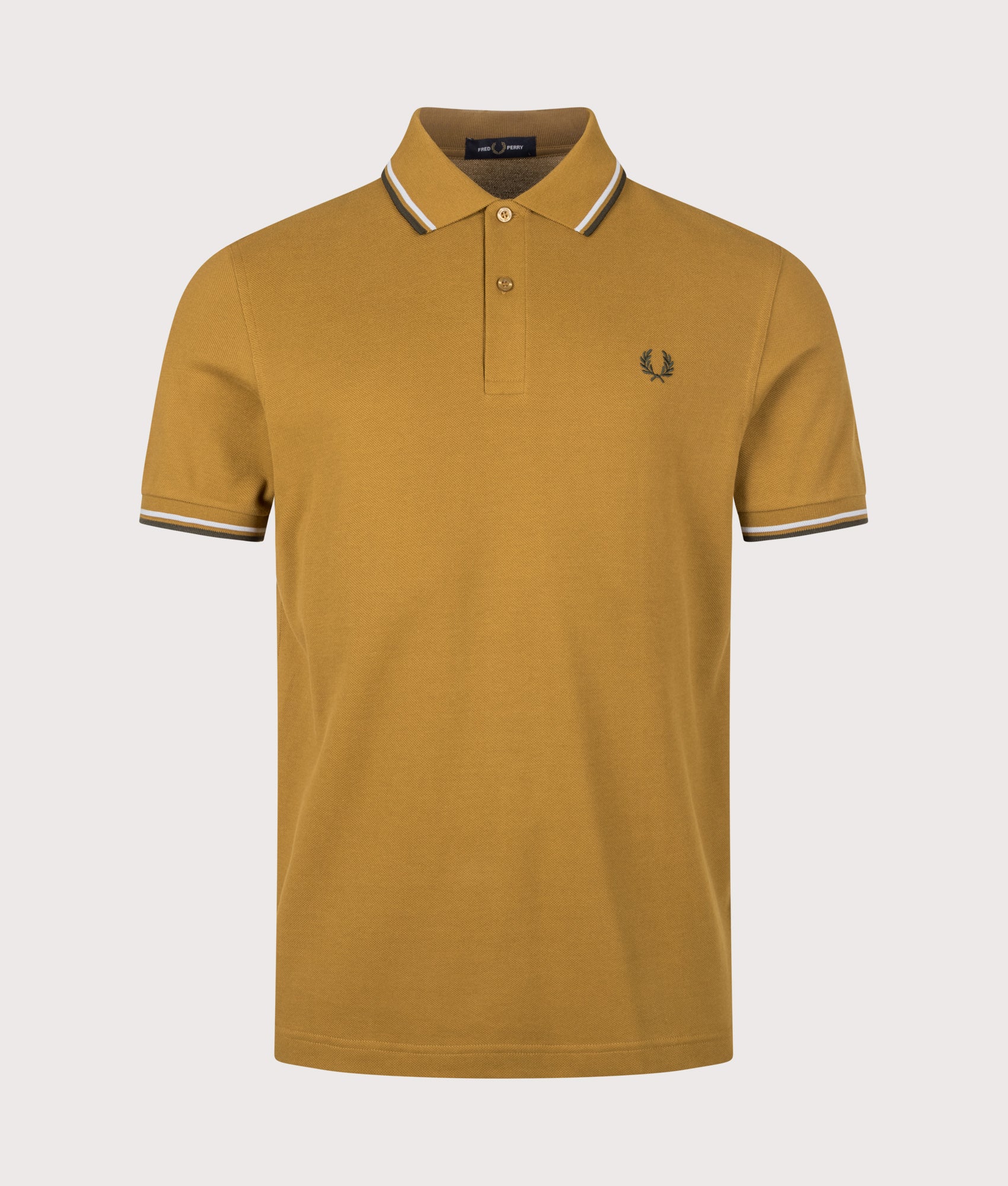 Fred Perry Twin Tipped Polo Shirt in Dark Caramel, Dusky Blue and Night Green at EQVVS Menswear. Front shot.