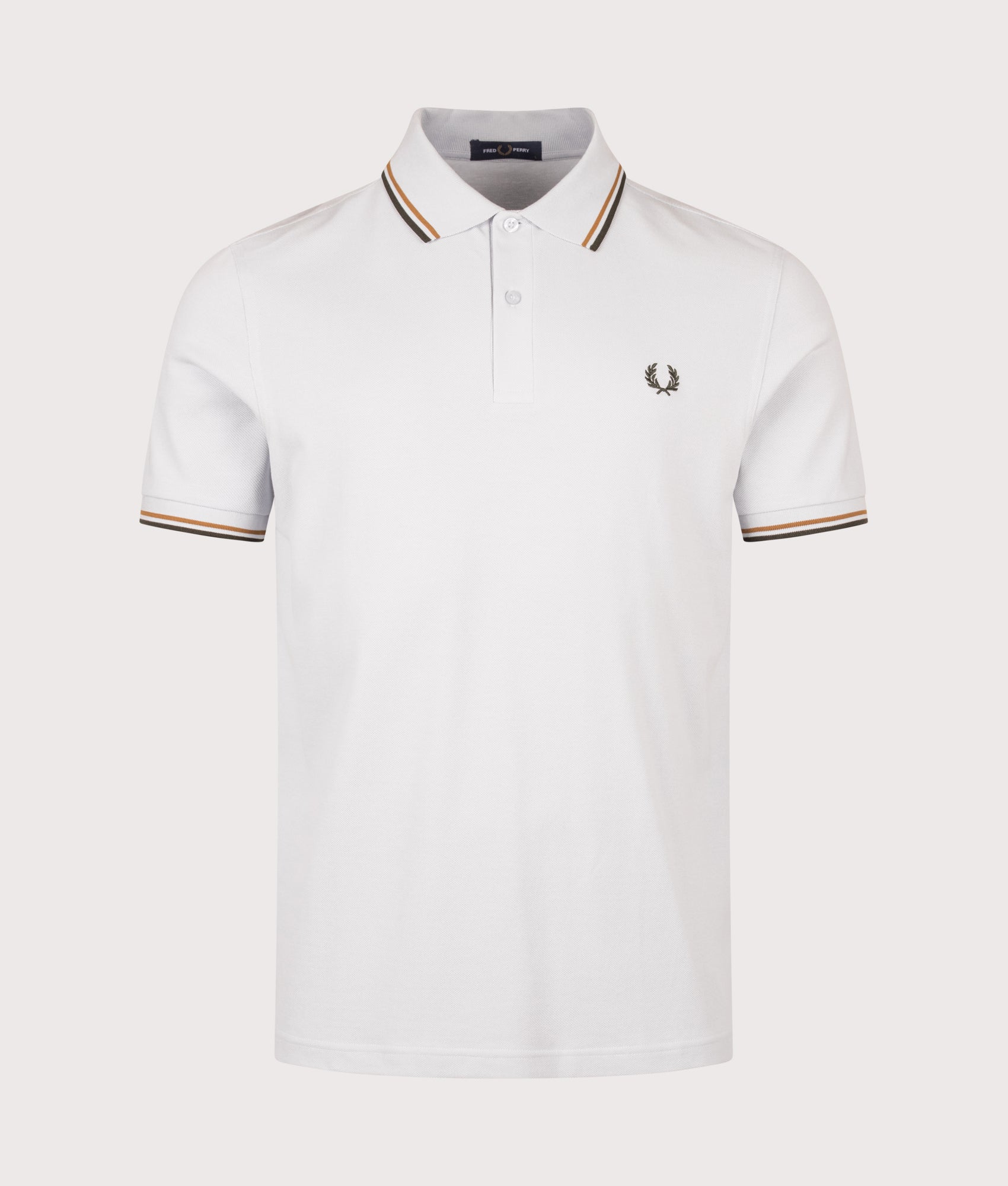 Fred Perry Twin Tipped Polo Shirt in Dusky Blue, Dark Caramel and Night Green at EQVVS Menswear. Front shot.