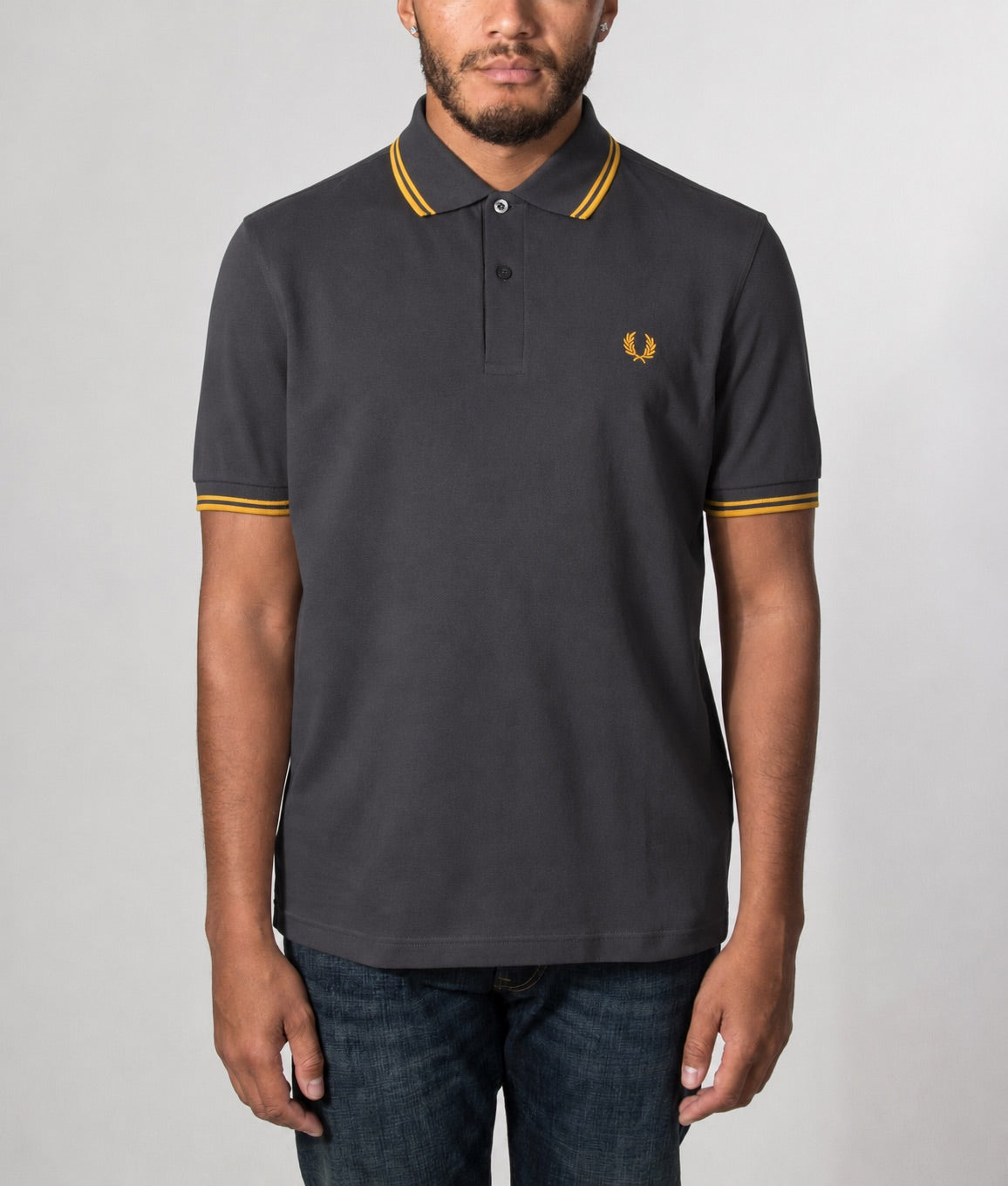Fred Perry Twin Tipped Polo Shirt in Anchor Grey and Golden colourway. Model front shot.