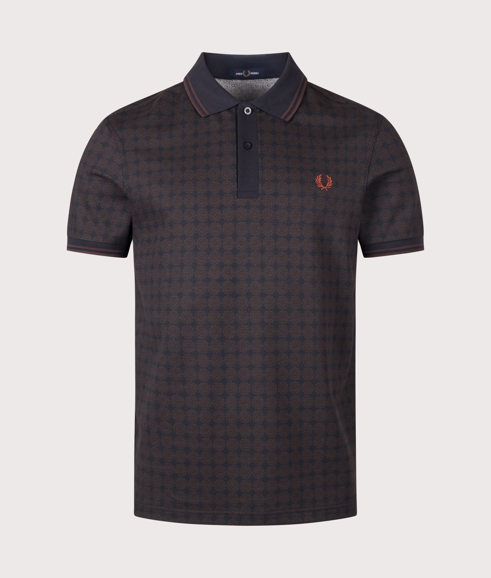 Fred Perry Regular Fit Floral Print Polo Shirt in Navy at EQVVS Menswear. Front shot.
