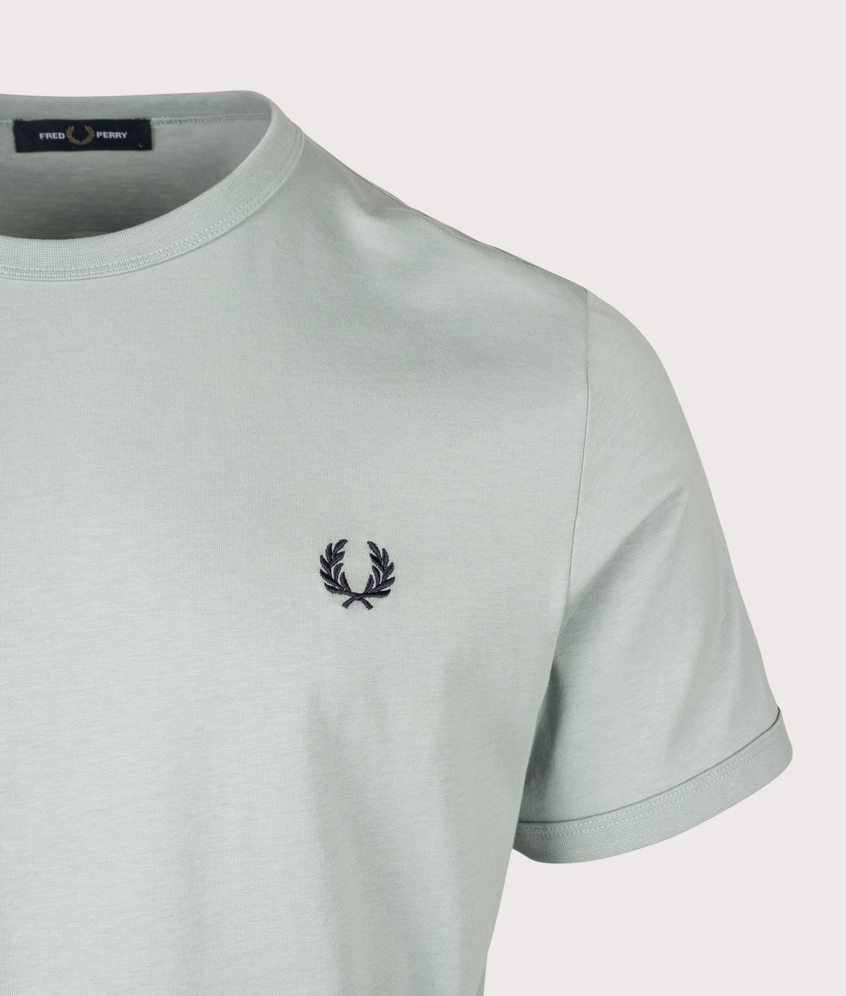 Fred Perry Regular Fit Ringer T-Shirt in Silver Blue at EQVVS Menswear. Detail shot.