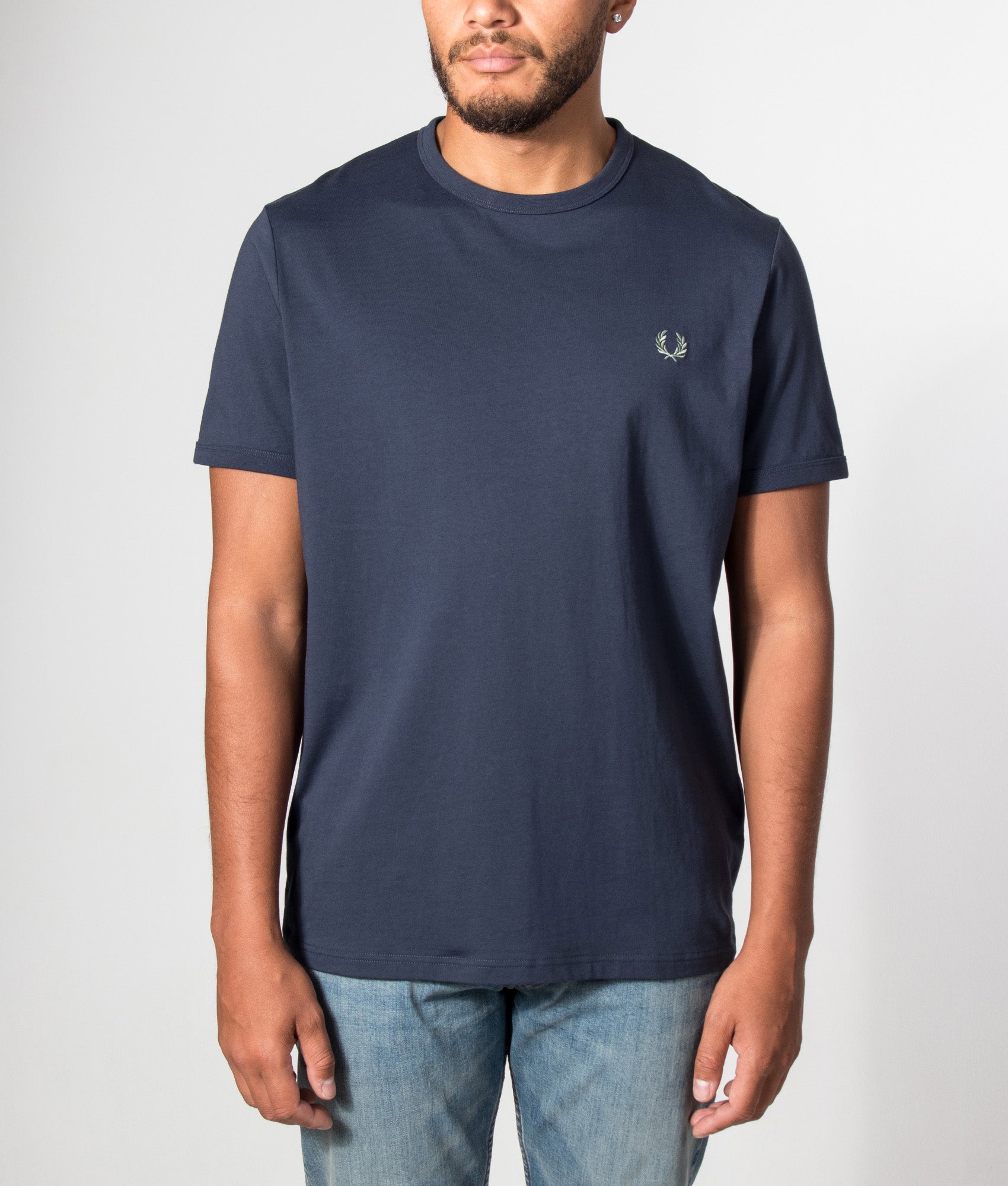 Fred Perry Regular Fit Ringer T-Shirt in Dark Airforce at EQVVS Menswear. Model front shot.