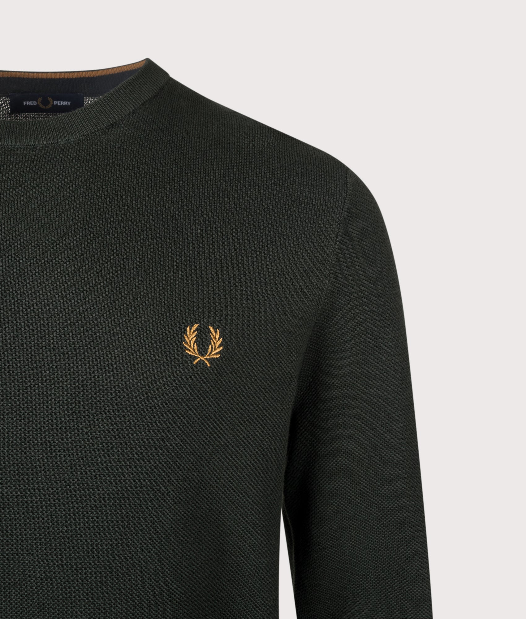 Fred Perry Regular Fit Piqué Stitch Jumper in Night Green at EQVVS Menswear. Detail shot.
