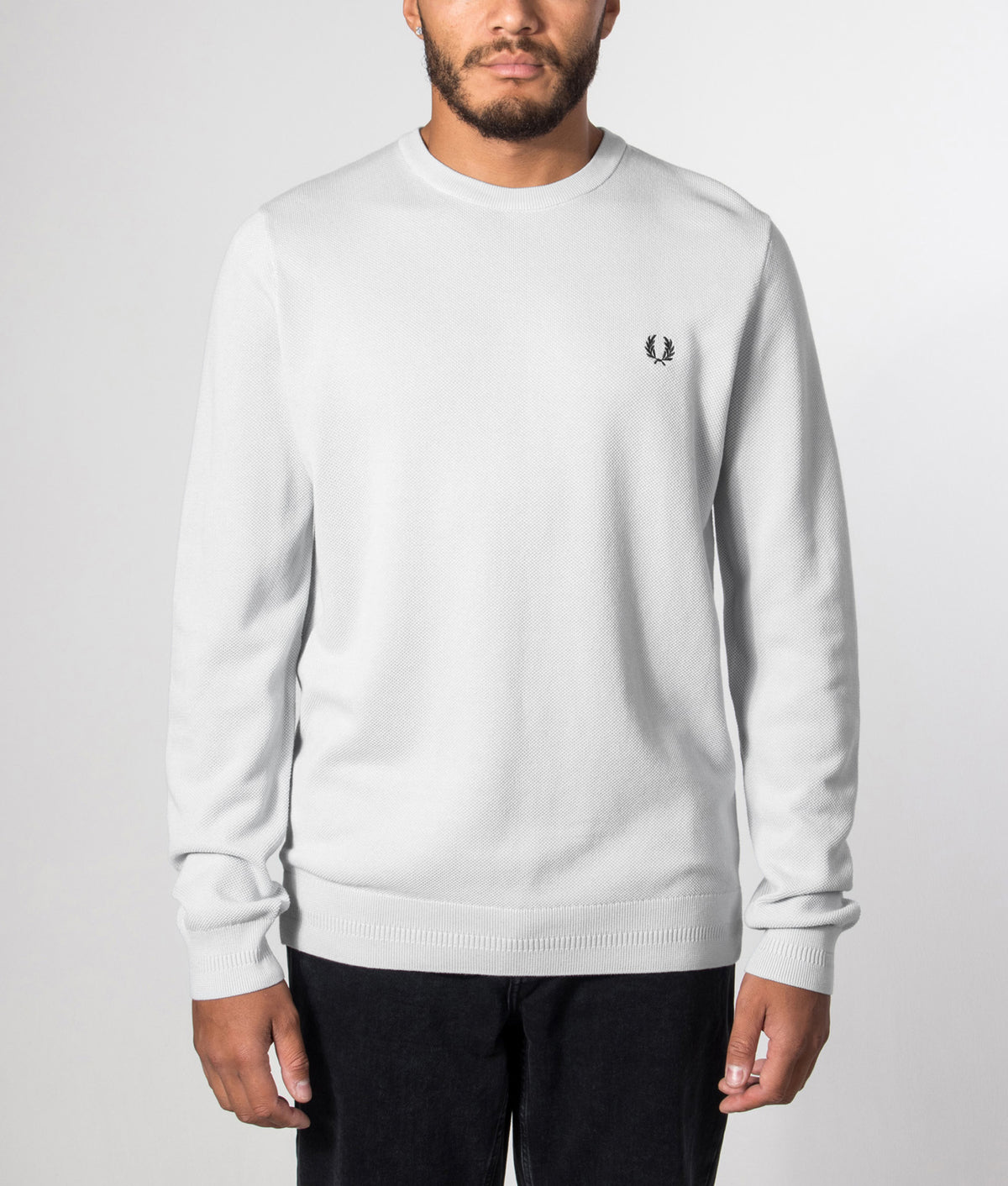 Fred Perry Regular Fit Piqué Stitch Jumper in Dusky Blue at EQVVS Menswear. Model front shot.