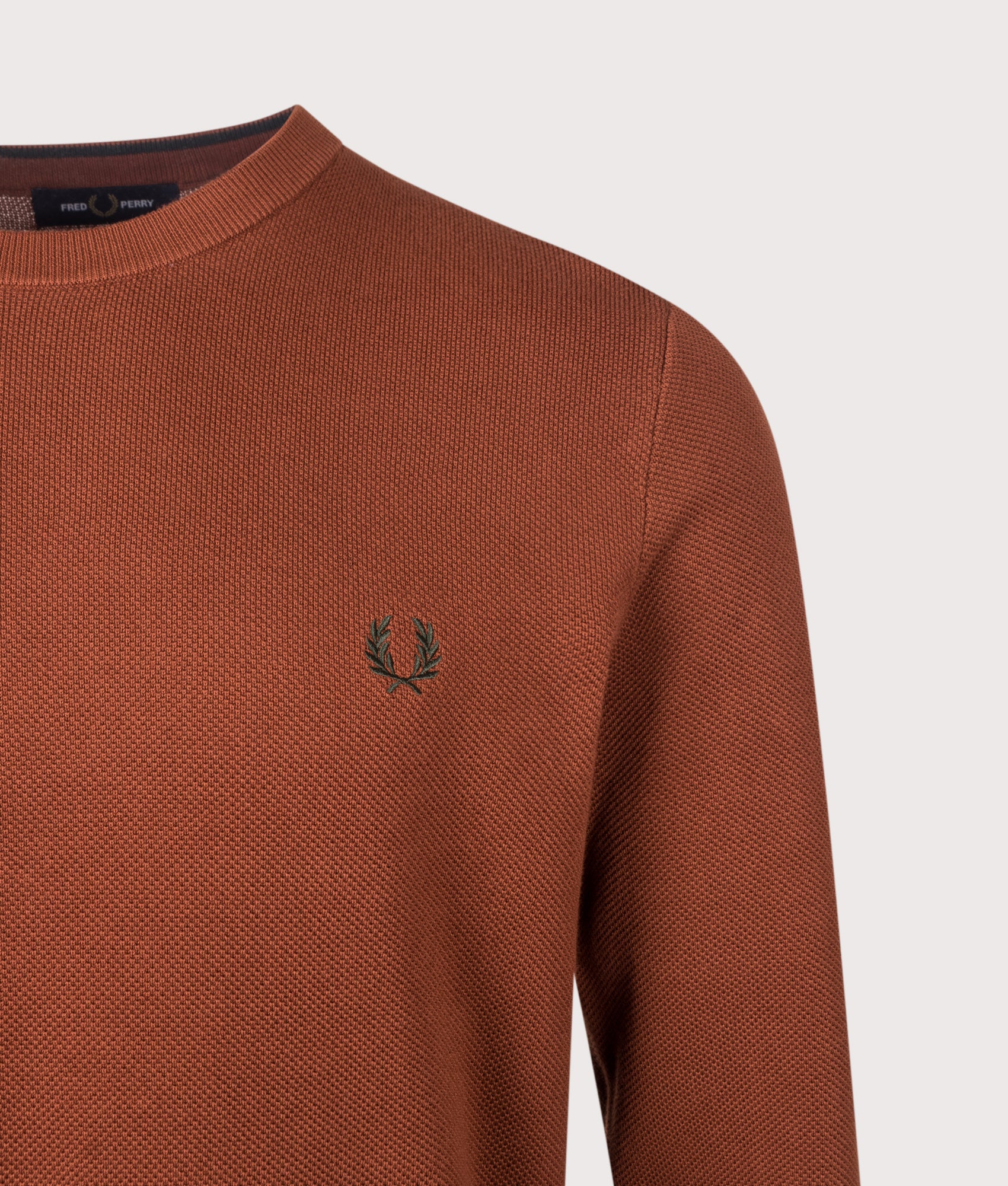 Fred Perry Regular Fit Piqué Stitch Jumper in Brandy at EQVVS Menswear. Detail shot.
