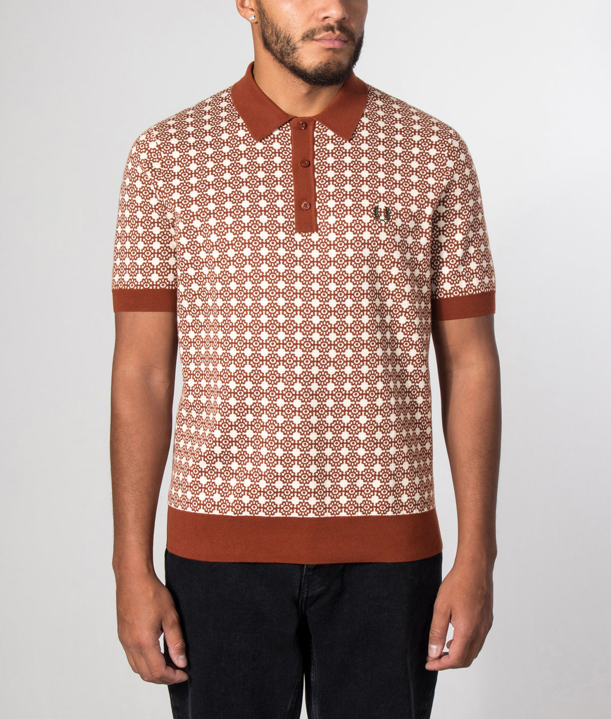 Fred Perry Regular Fit Floral Jacquard Polo Shirt in Brandy at EQVVS Menswear. Model front shot.