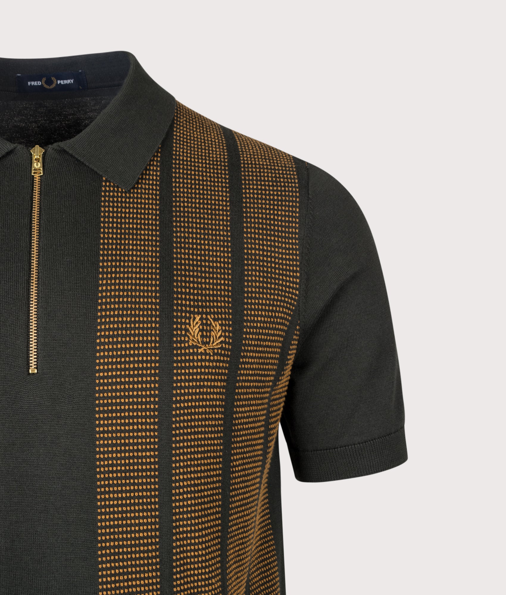 Fred Perry Regular Fit Textured Panel Zip Neck Knitted Polo Shirt in Night Green at EQVVS Menswear. Detail shot.