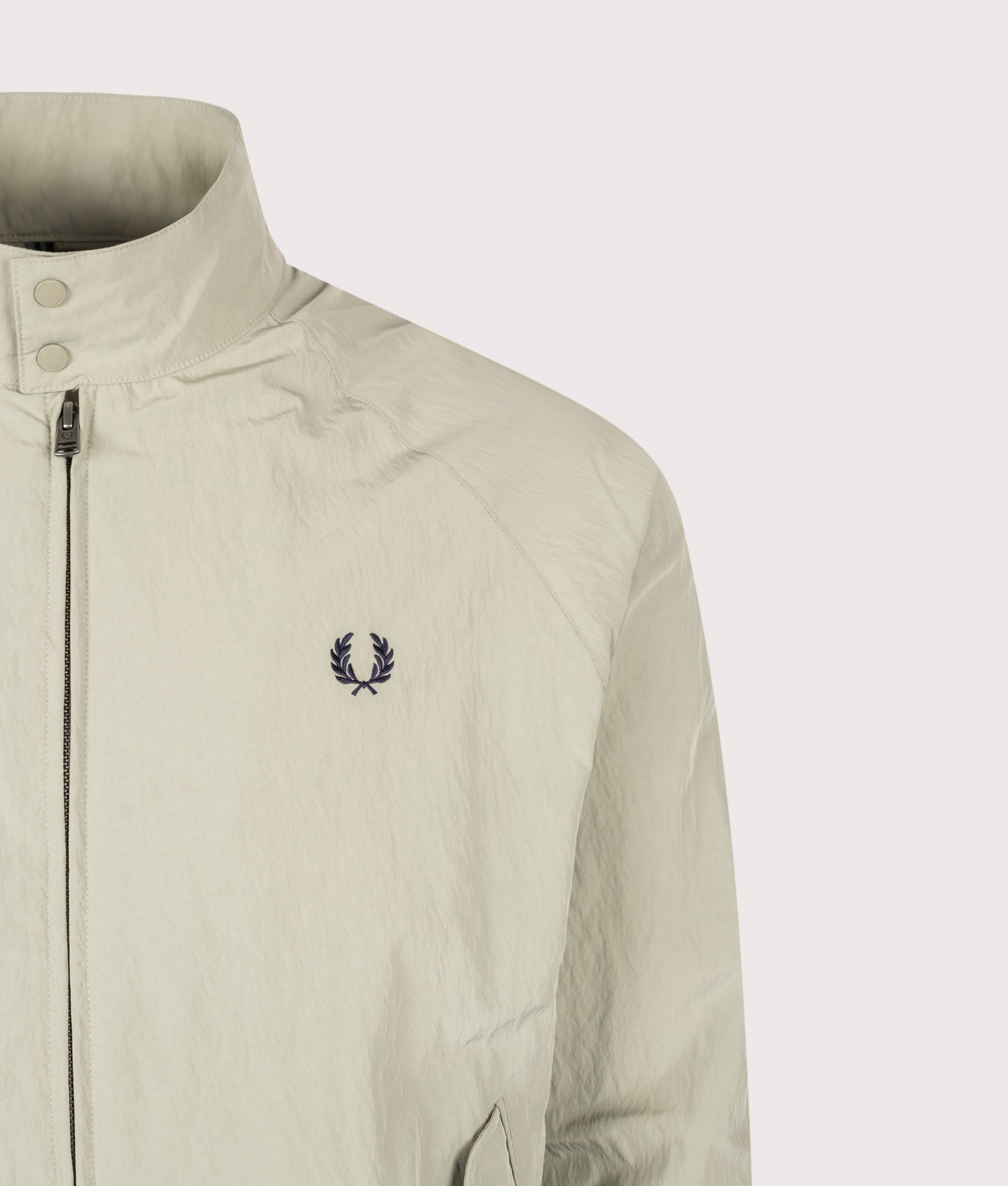 Fred Perry Regular Fit Crinkle Nylon Harrington Jacket in Seagrass at EQVVS Menswear. Detail shot.