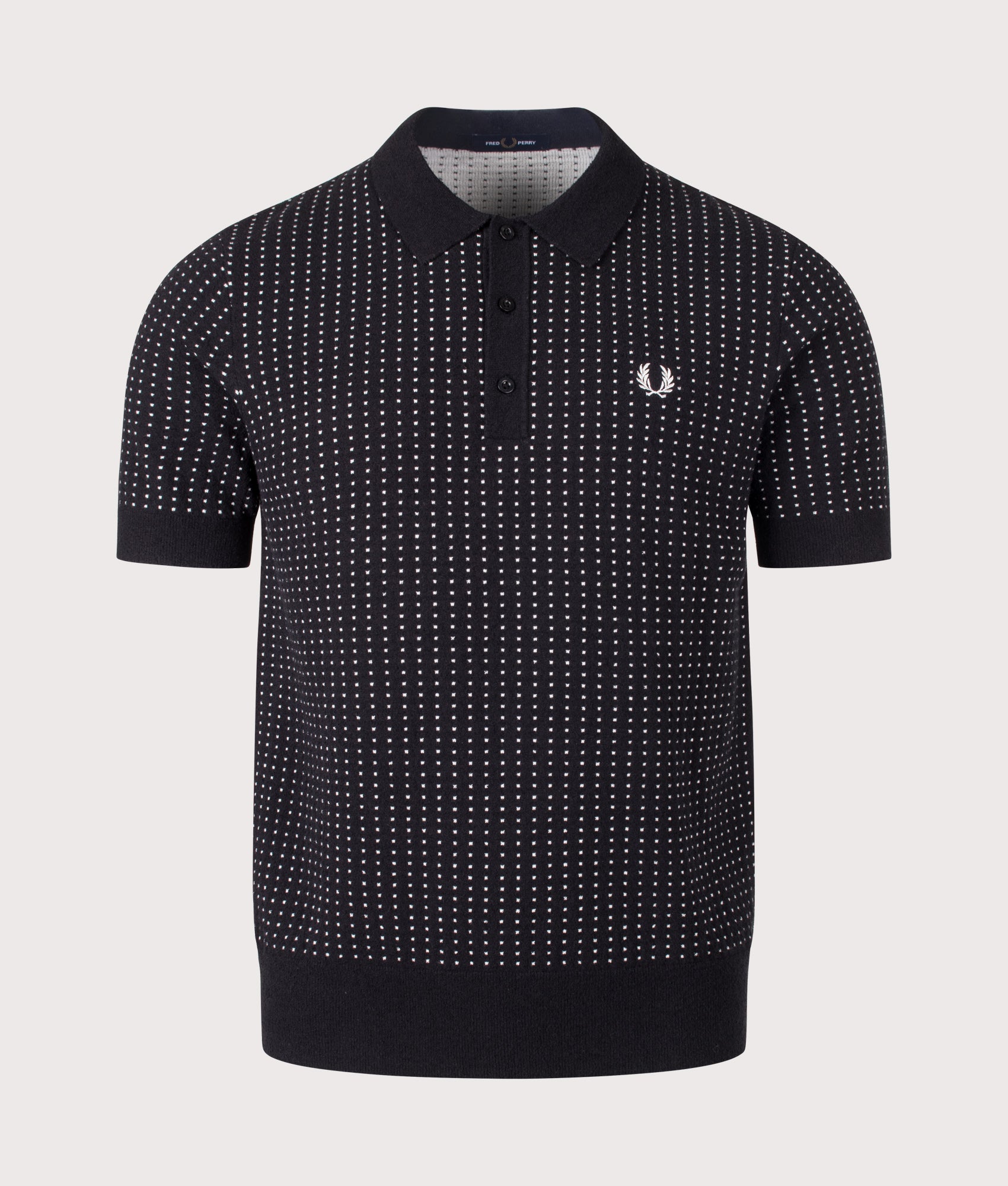 Fred Perry Regular Fit Bouclé Dot Knitted Polo Shirt in Black at EQVVS Menswear. Front shot.