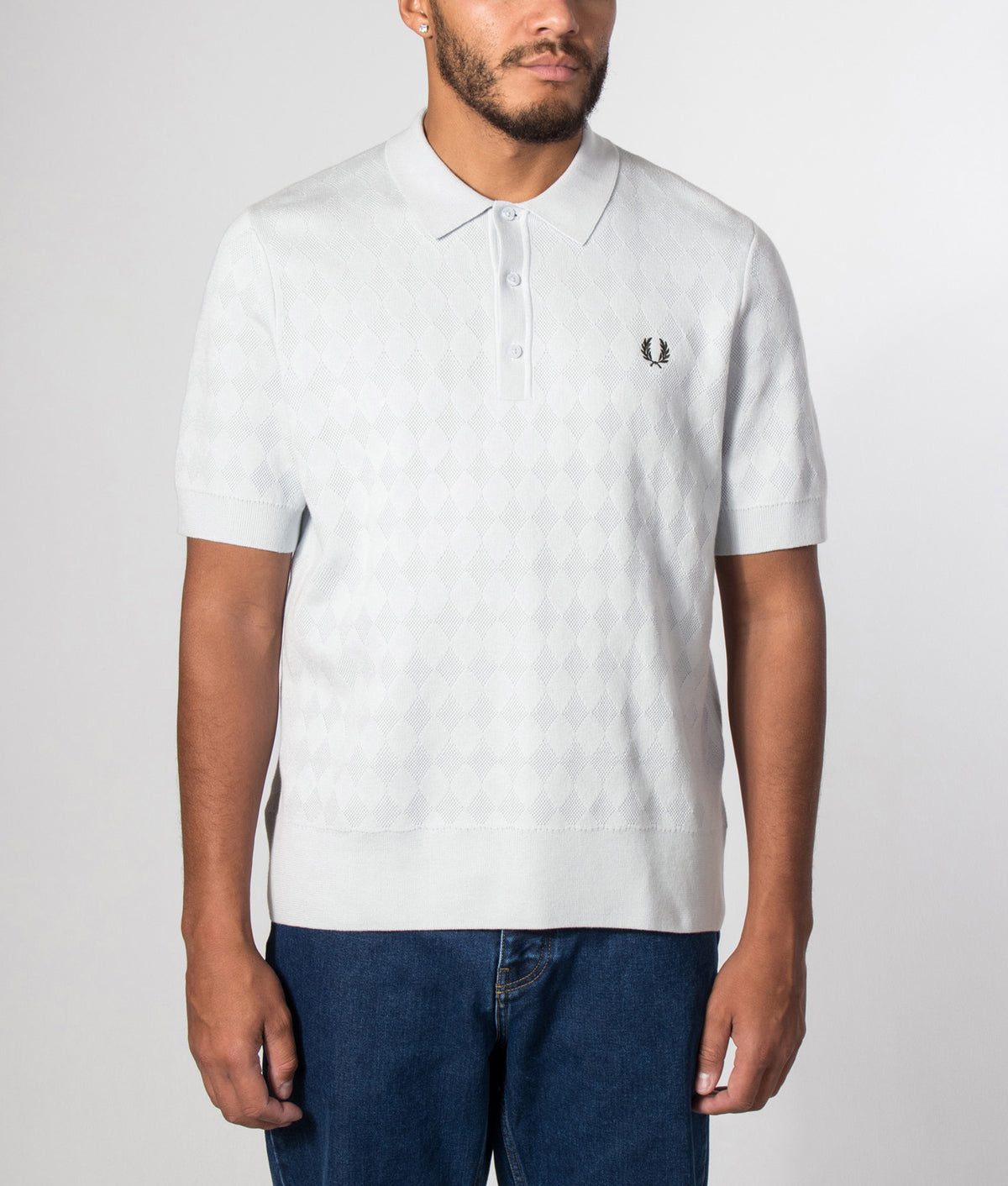 Fred Perry Regular Fit Pointelle Knitted Polo Shirt in Dusky Blue at EQVVS Menswear. Model front shot.