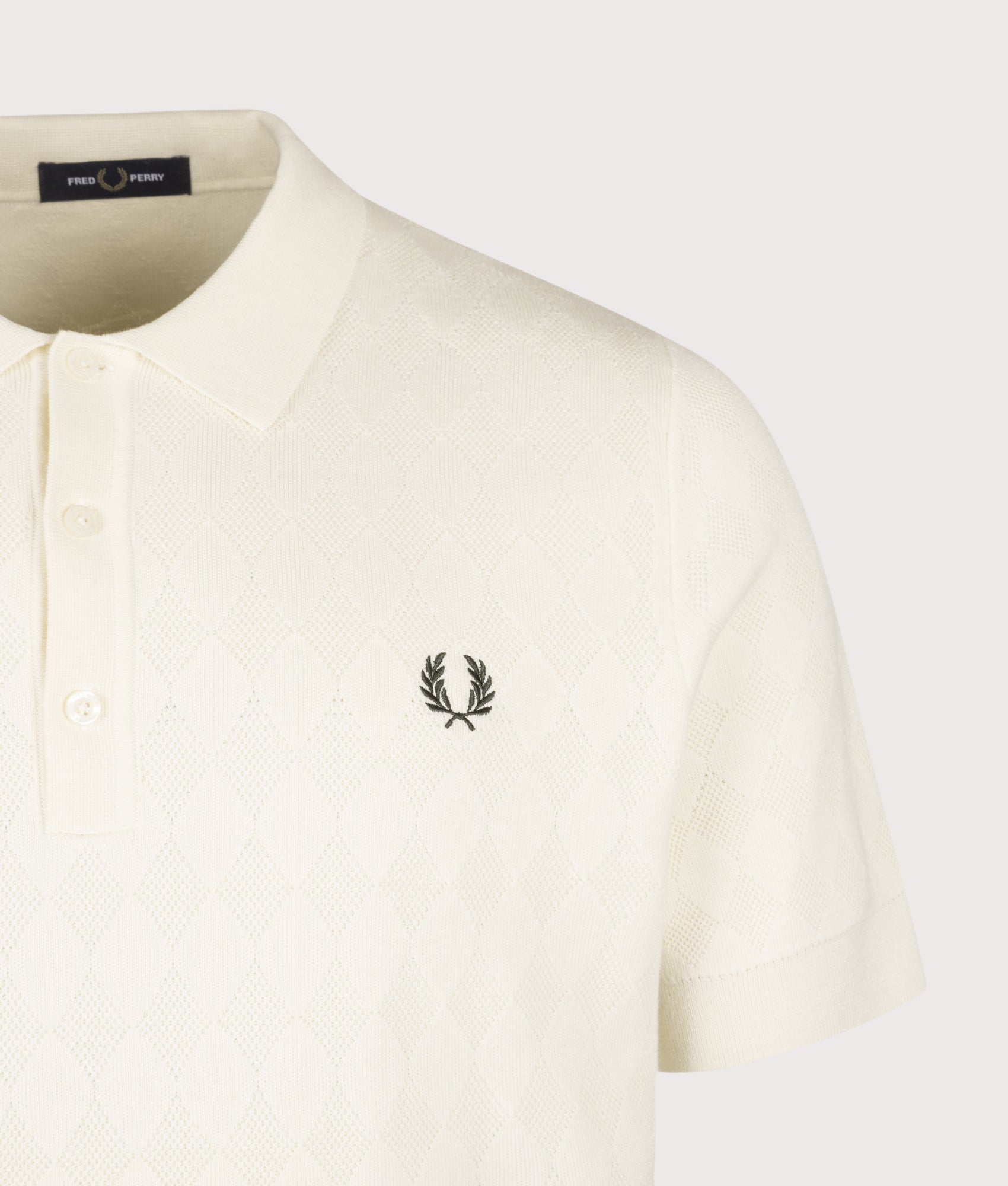 Fred Perry Regular Fit Pointelle Knitted Polo Shirt in Ecru at EQVVS menswear. Detail shot.