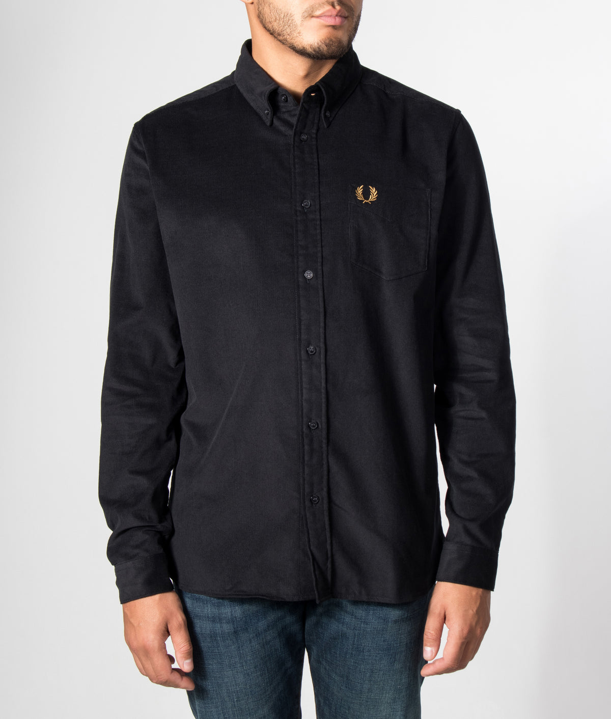 Fred Perry Regular Fit Needle Cord Shirt in Black at EQVVS Menswear. Model front shot.