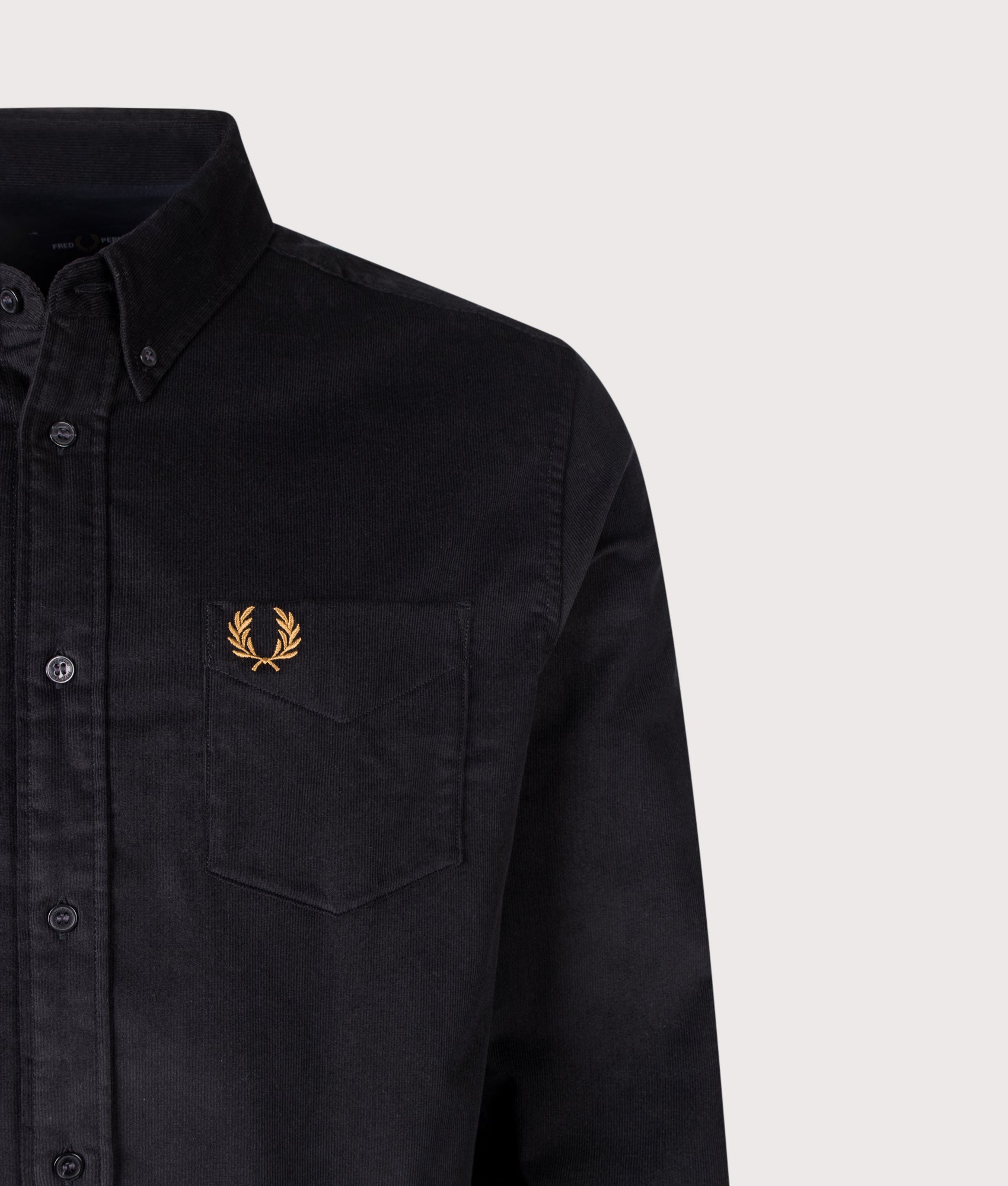 Fred Perry Regular Fit Needle Cord Shirt in Black at EQVVS Menswear. Detail shot.