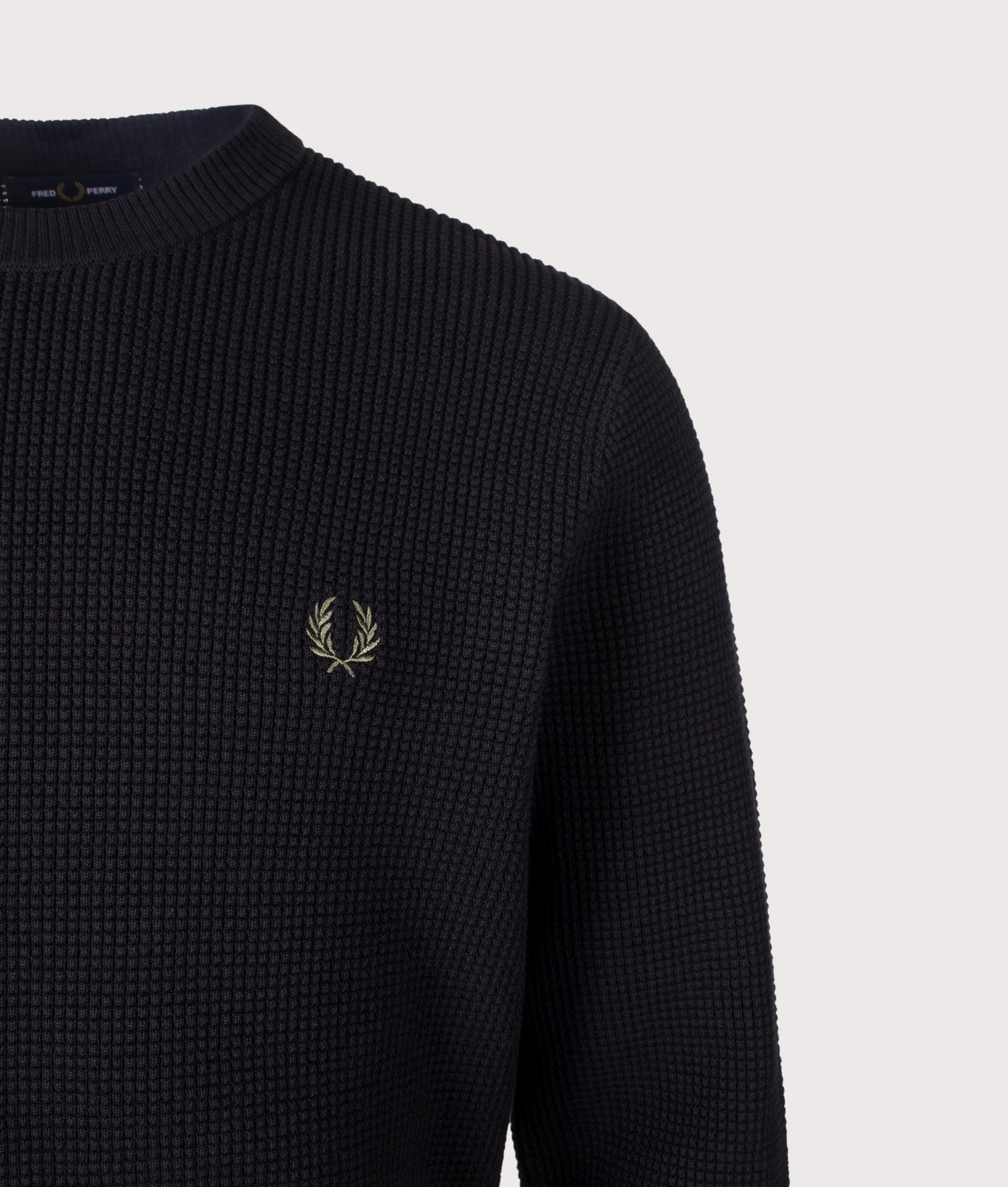 Fred Perry Regular Fit Waffle Stitch Jumper in Black at EQVVS Menswear. Detail shot.