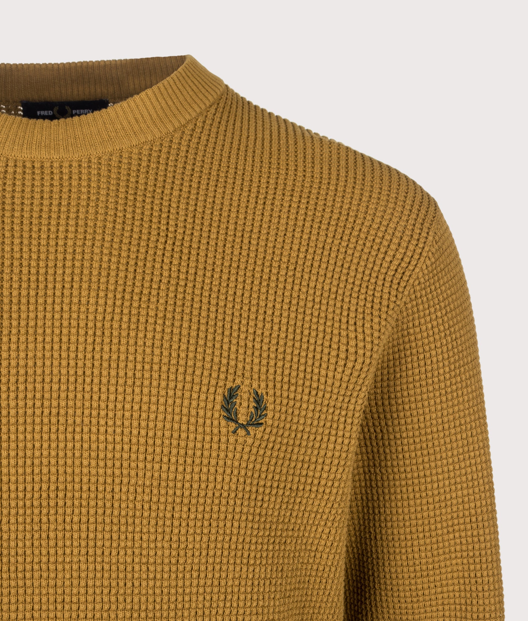 Fred Perry Regular Fit Waffle Stitch Jumper in Dark Caramel at EQVVS Menswear. Detail shot.