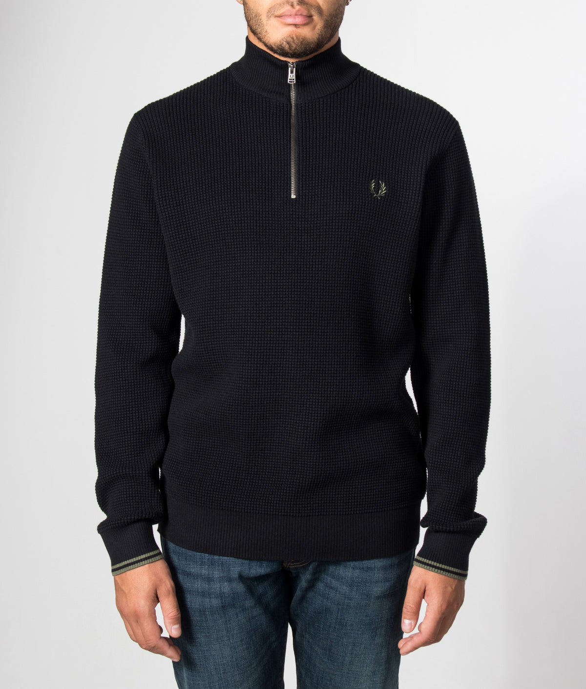 Fred Perry Regular Fit Waffle Stitch Quarter Zip Jumper in Black at EQVVS Menswear. Model front shot.