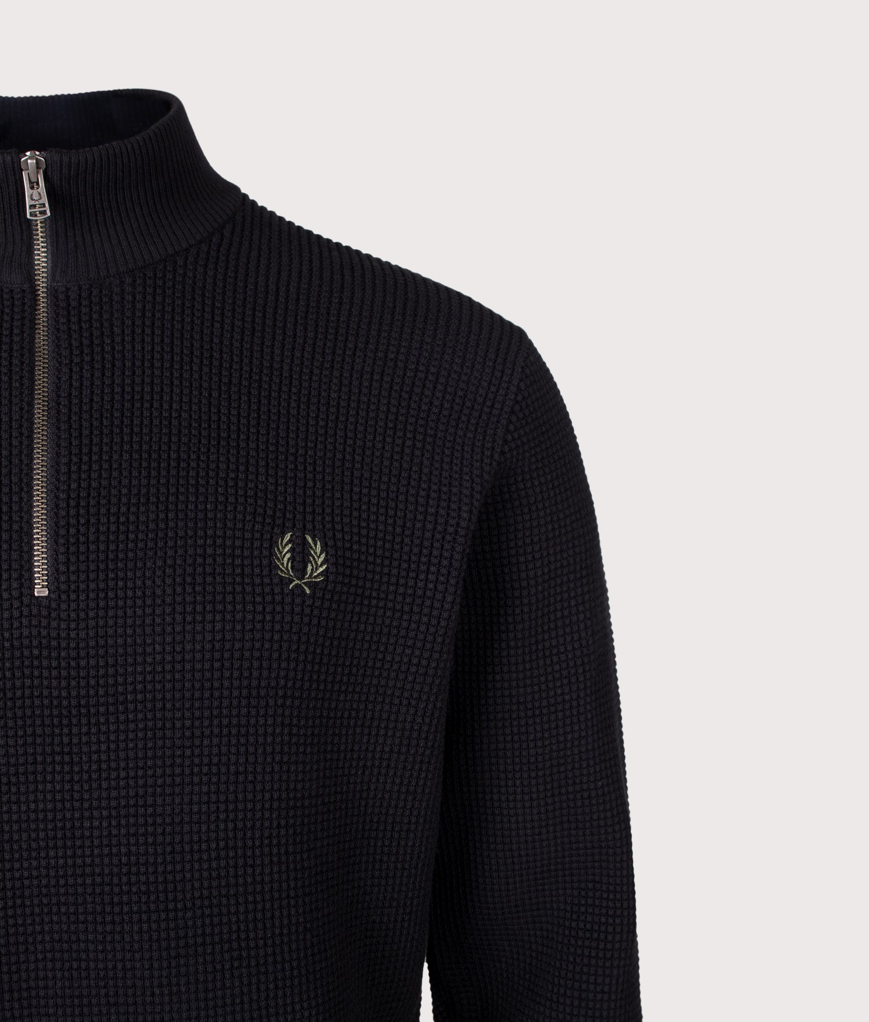 Fred Perry Regular Fit Waffle Stitch Quarter Zip Jumper in Black at EQVVS Menswear. Detail shot.