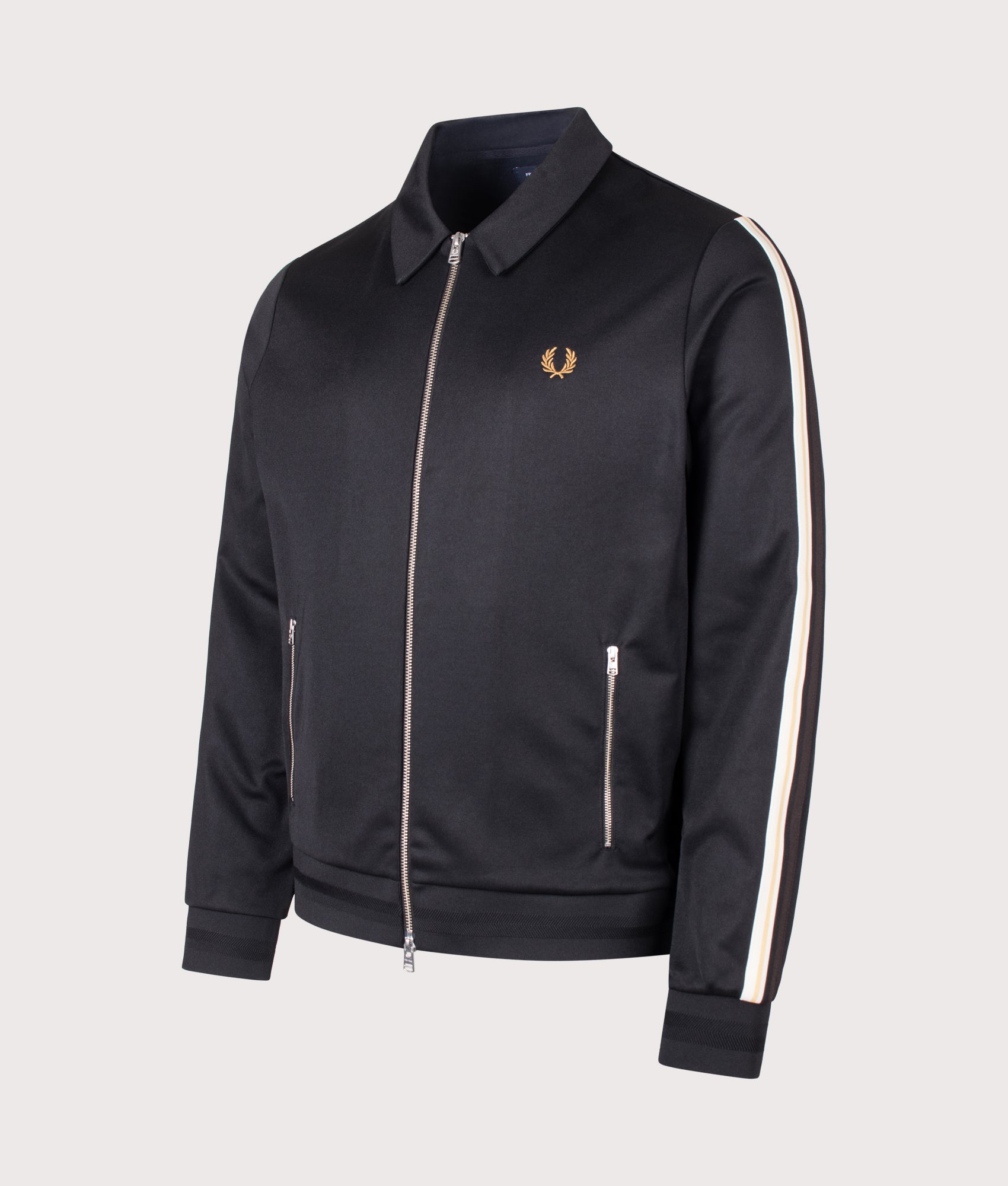 Fred Perry Regular Fit Tipped Tape Track Jacket in Black at EQVVS Menswear. Angled front shot.